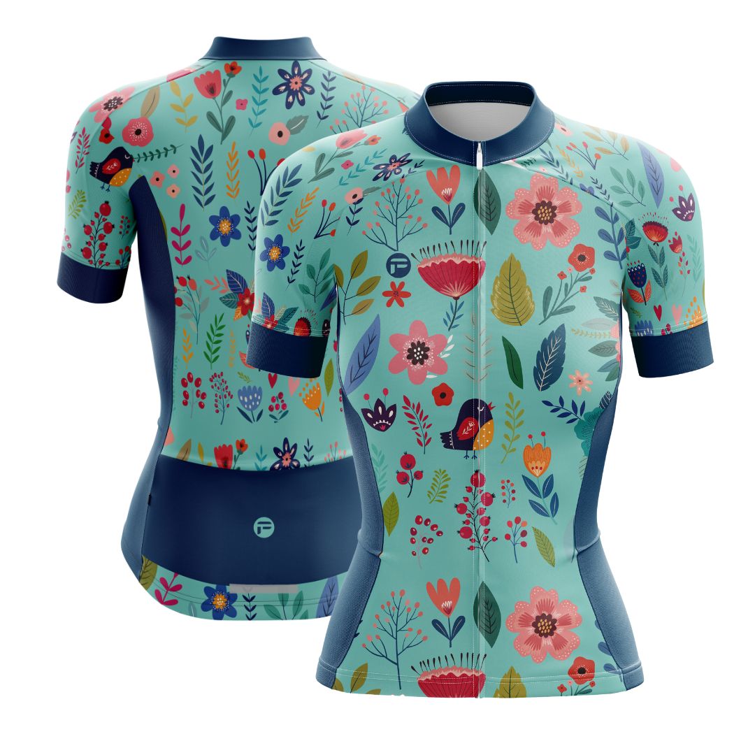 Blooming Garden Women's Cycling Jersey featuring a vibrant and colorful floral design on a turquoise background, designed for optimal comfort, breathability, and aerodynamics.