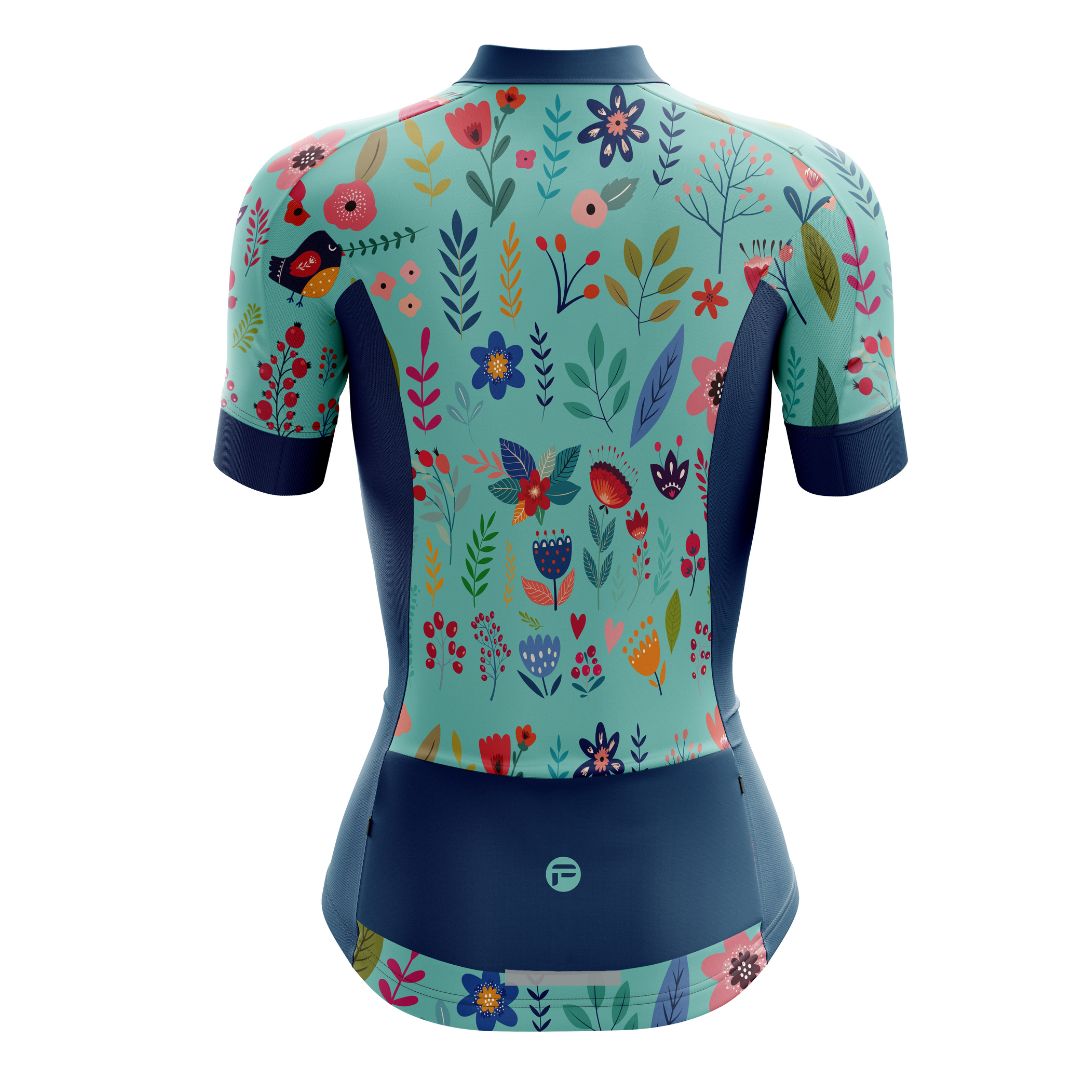 Blooming Garden Women's Cycling Jersey featuring a vibrant and colorful floral design on a turquoise  background, designed for optimal comfort, breathability, and aerodynamics.