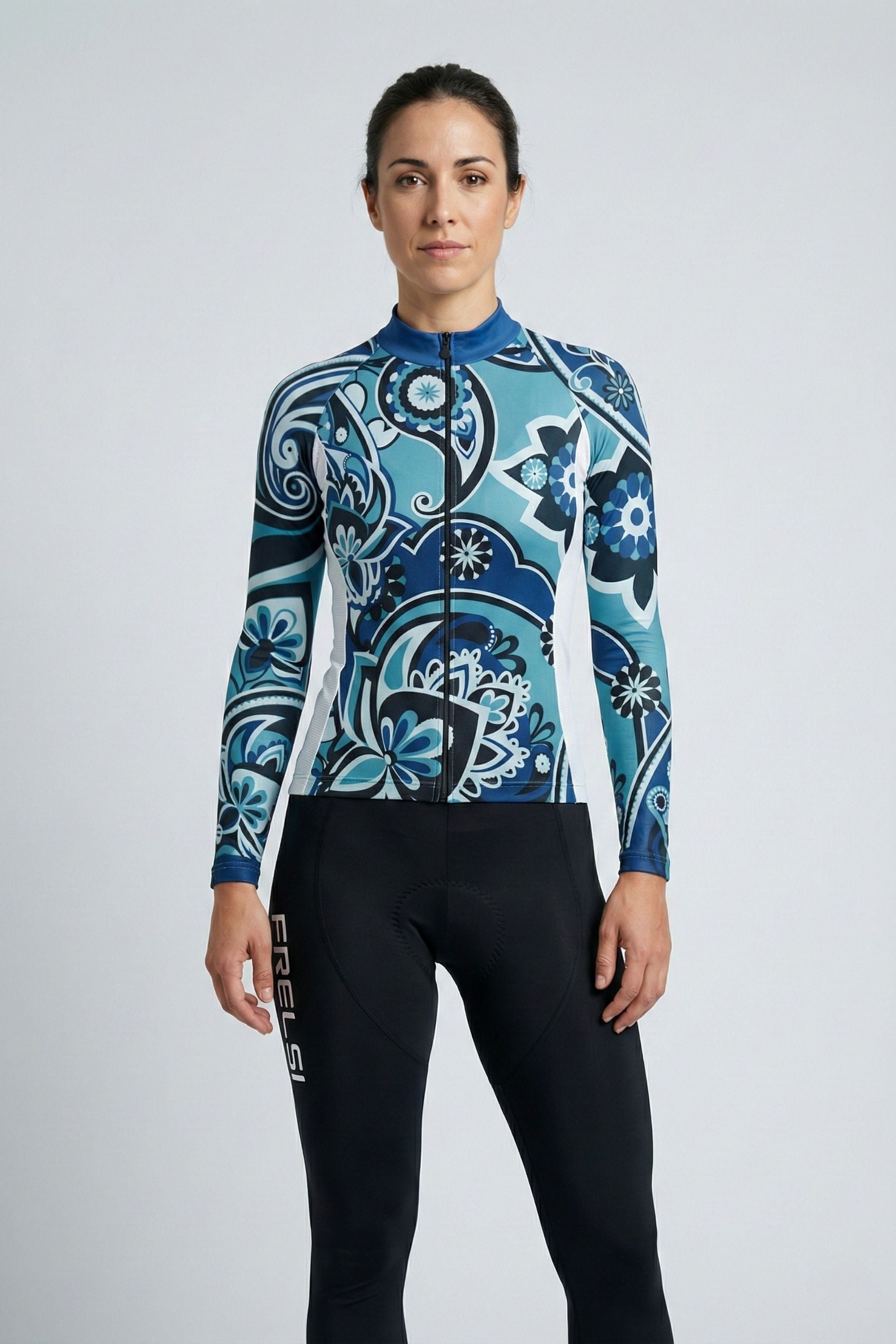 Person wearing a blue cycling outfit on a plain background by Cycling Frelsi