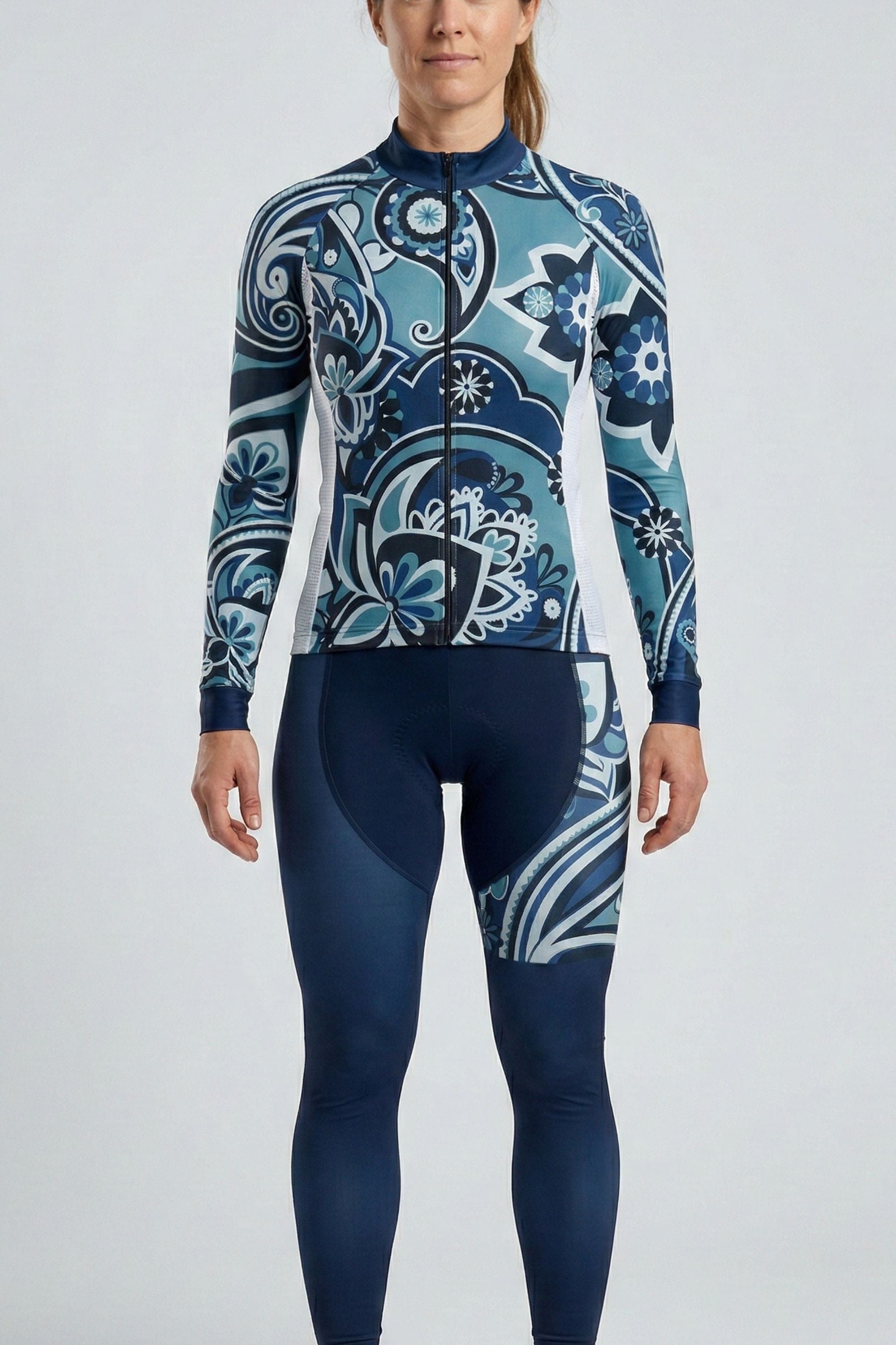 Person wearing a blue and white patterned wetsuit on a light gray background