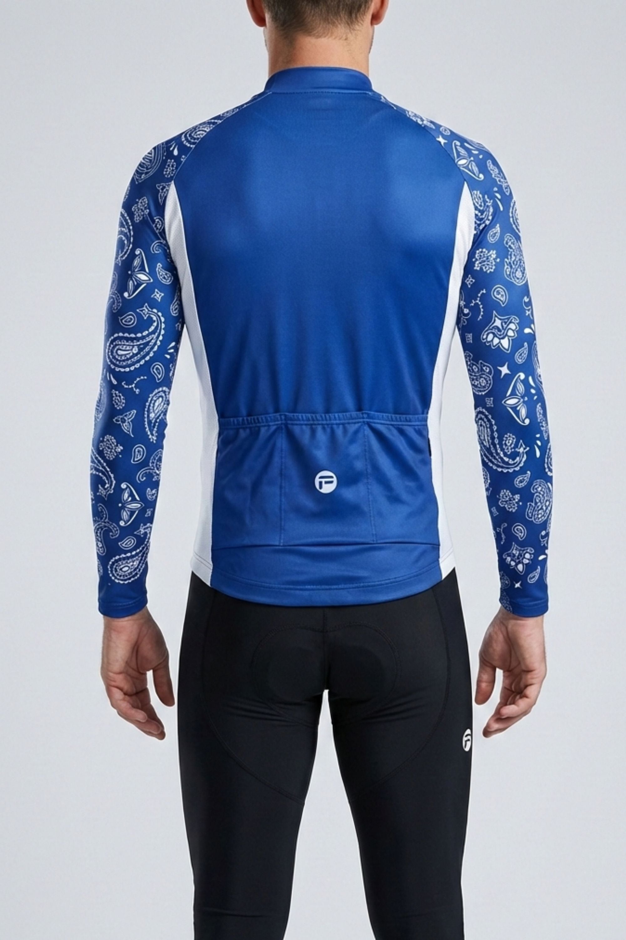 Blue cycling jersey with white patterns on sleeves and black pants on a gray background