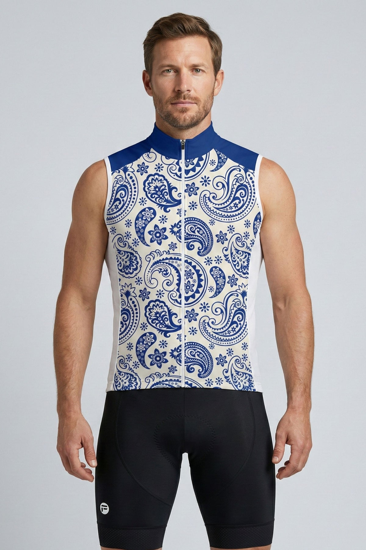 Man wearing a sleeveless cycling jersey with blue and white pattern on a gray background