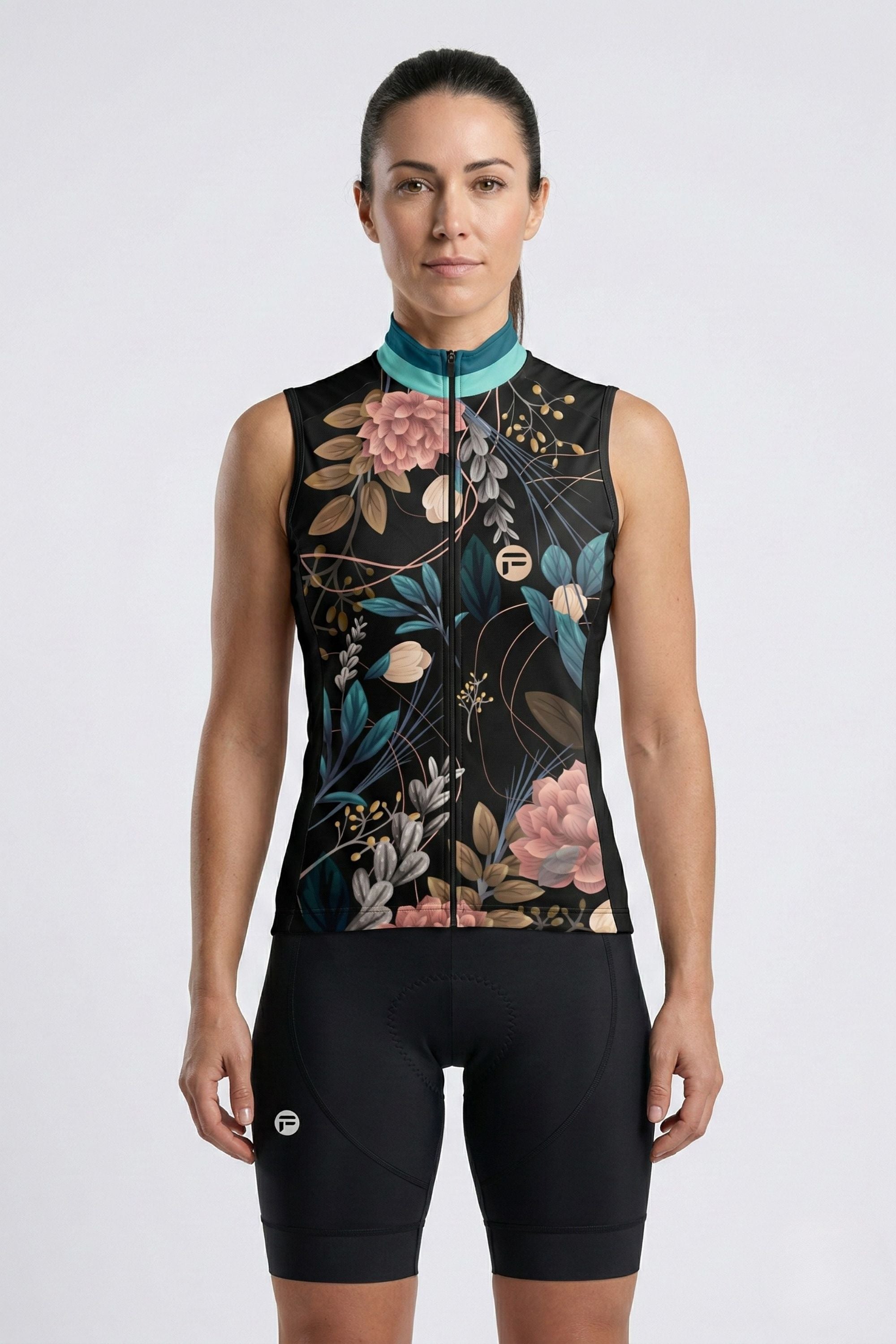 Woman wearing a sleeveless cycling outfit with floral design on a white background