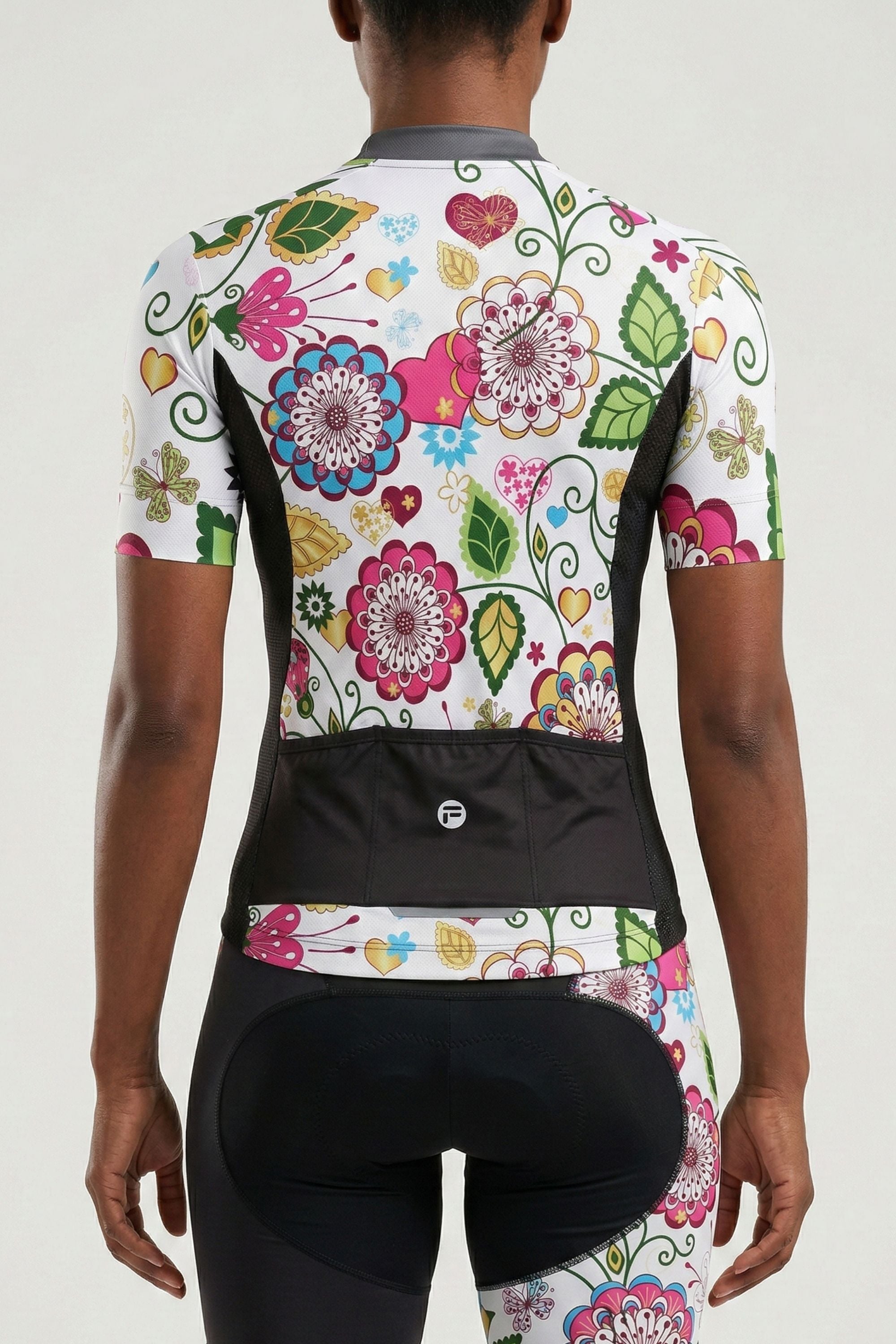 Cycling outfit with colorful floral design on a white background