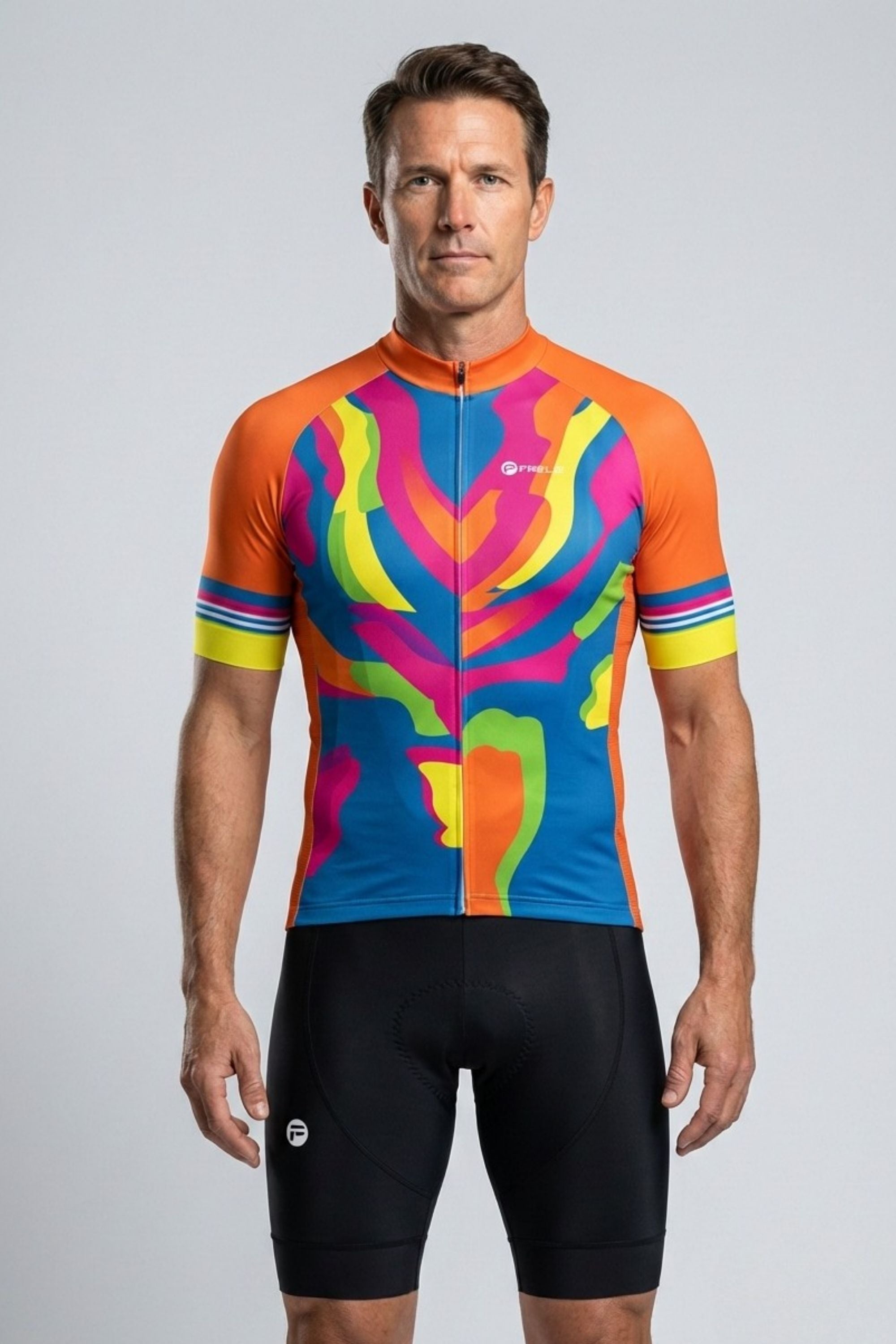 Man wearing a colorful cycling jersey and black shorts on a gray background