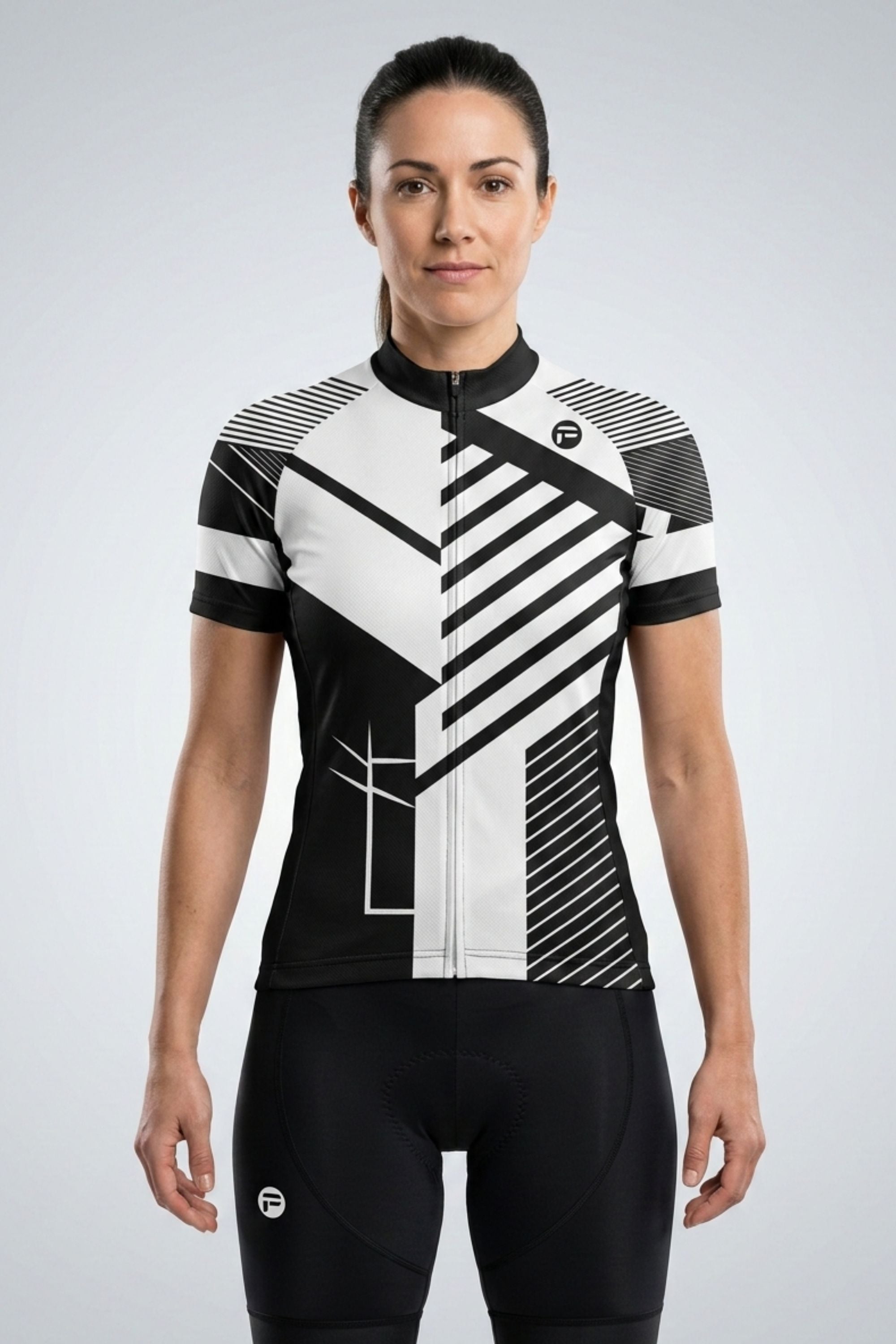 Person wearing a black and white cycling jersey on a light gray background