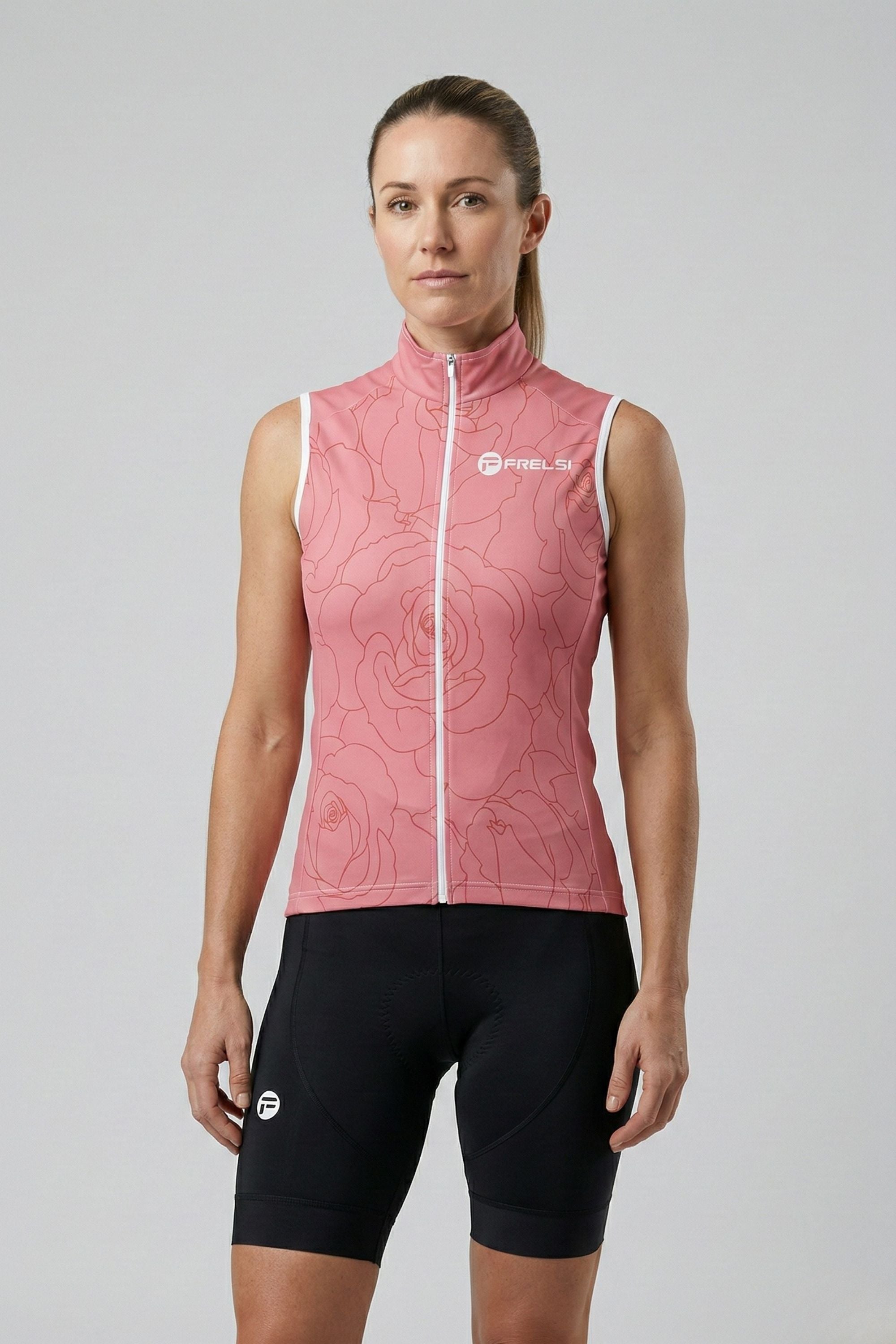 Woman wearing a pink cycling vest with a logo on a gray background