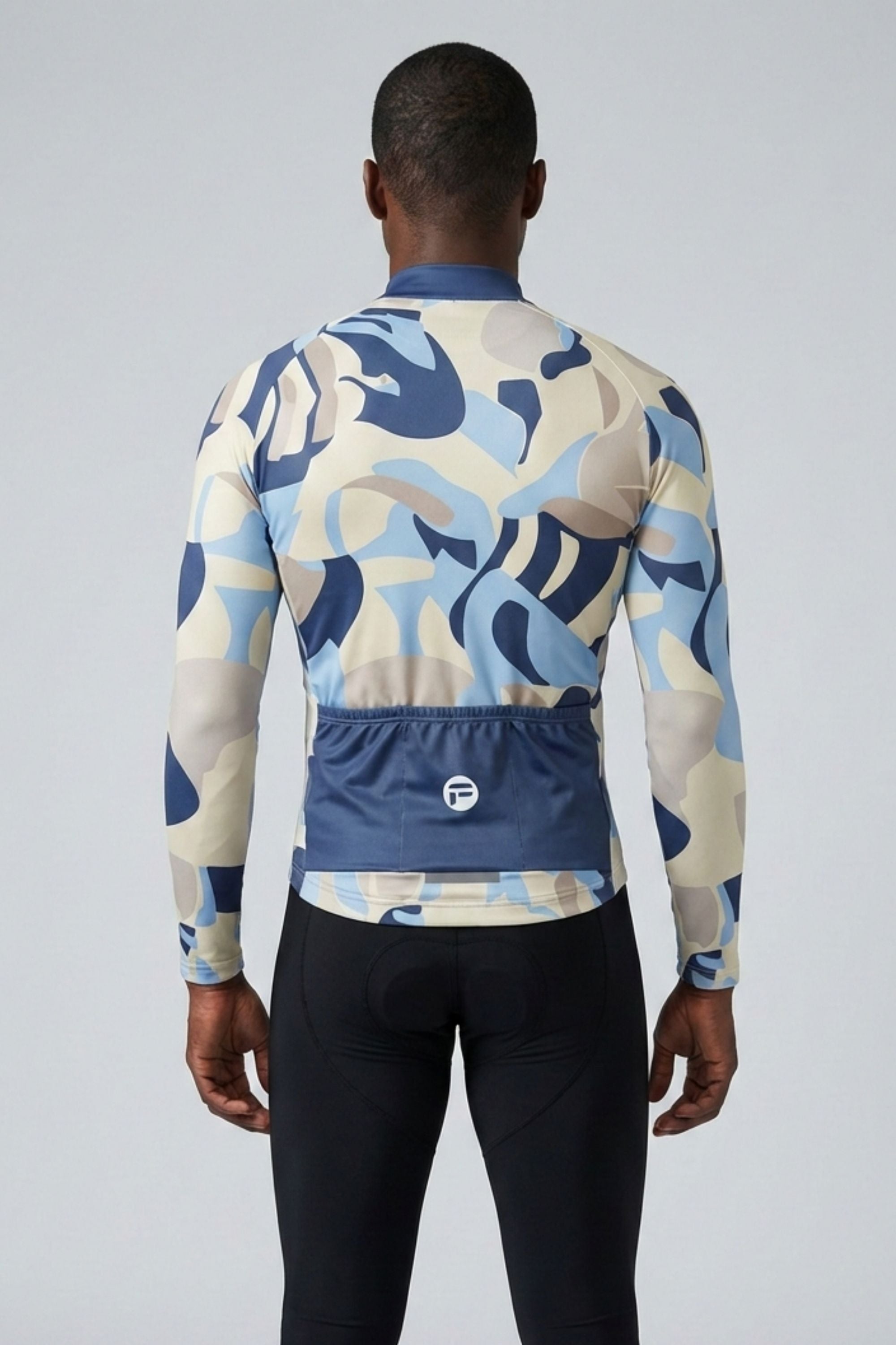 Person wearing a colorful cycling jersey with a white background