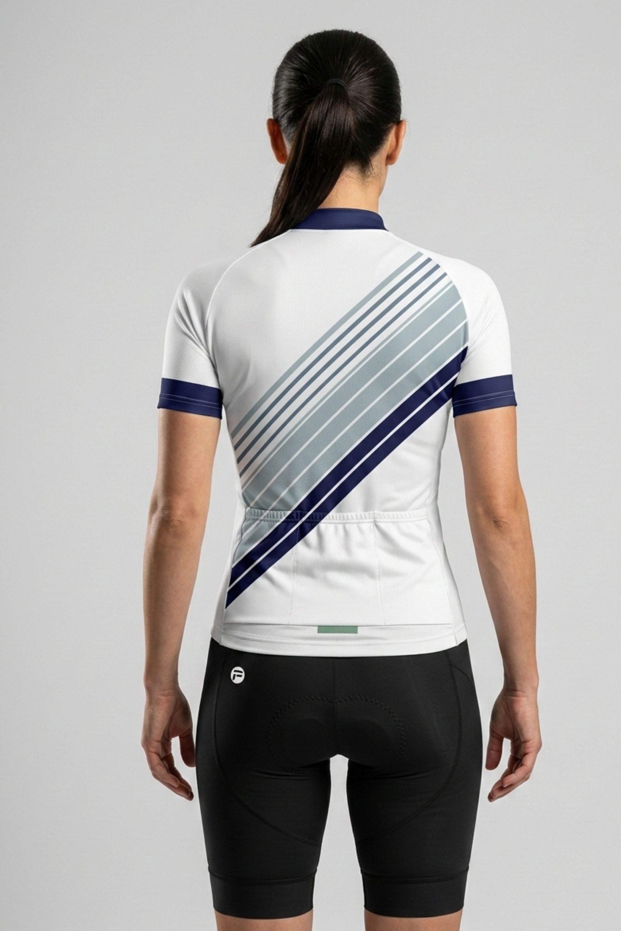 Person wearing a white cycling jersey with blue and gray diagonal stripe on a gray background
