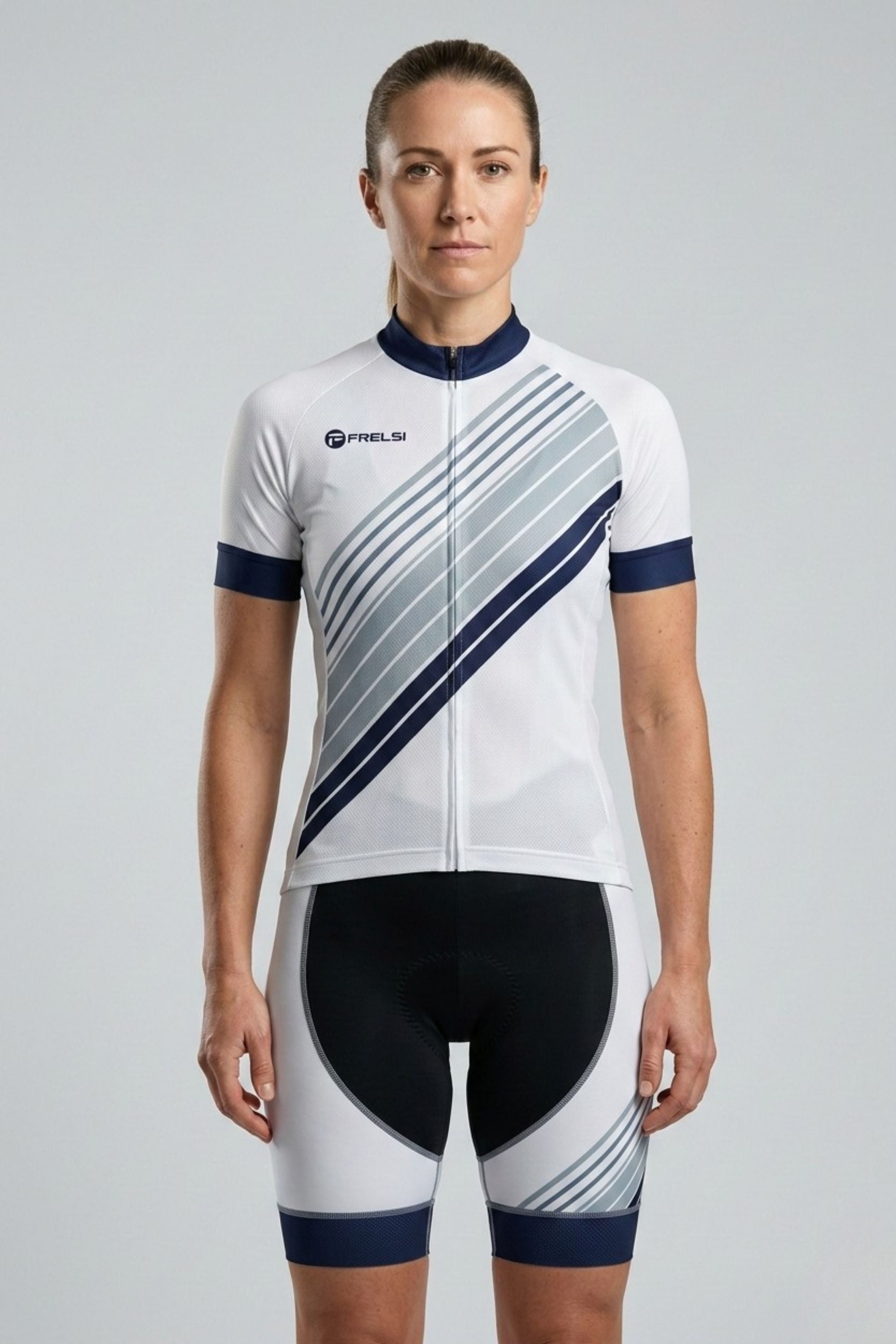 Person wearing a white and black cycling suit with a brand logo on a gray background
