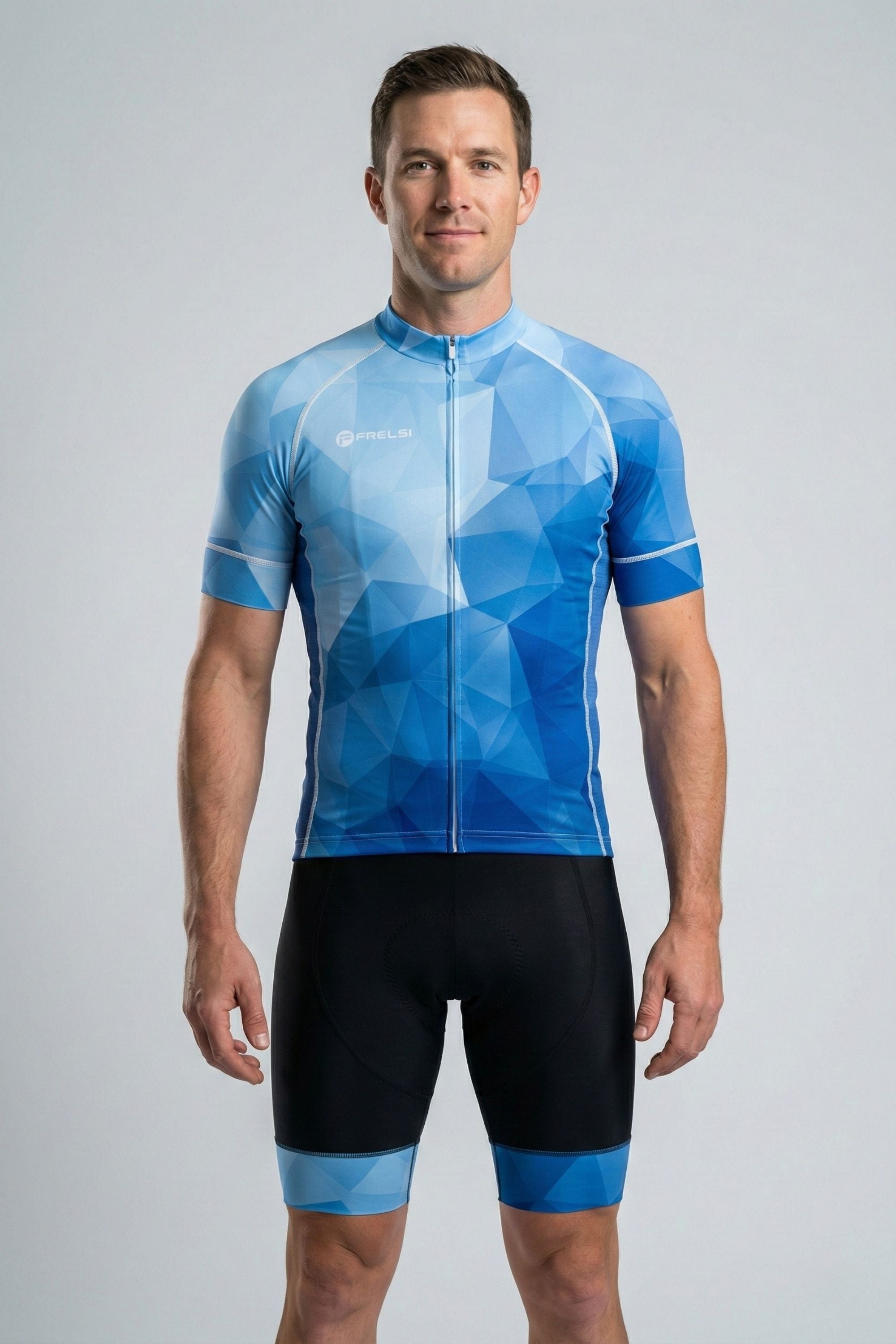 Man wearing a blue geometric pattern cycling jersey and shorts on a gray background