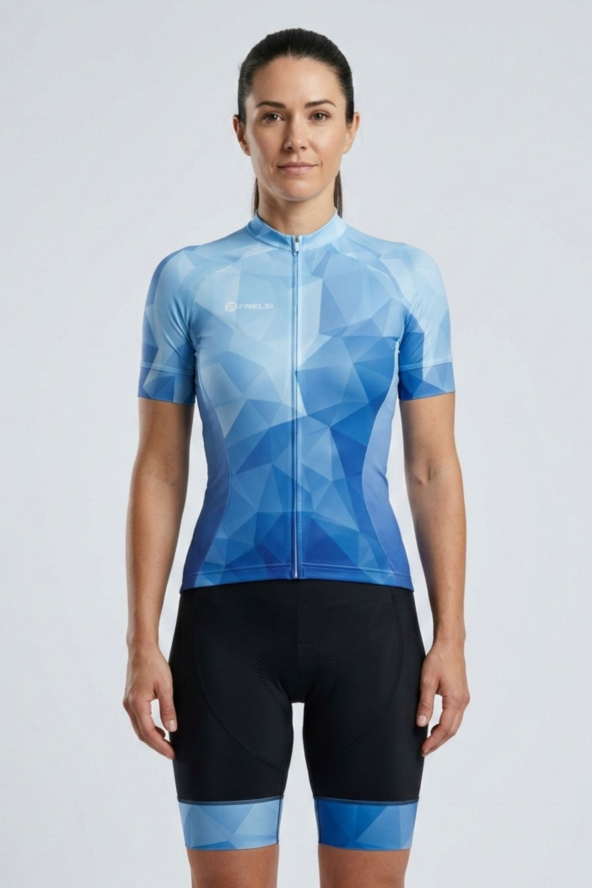 Person wearing a blue geometric patterned cycling jersey and black shorts on a light gray background