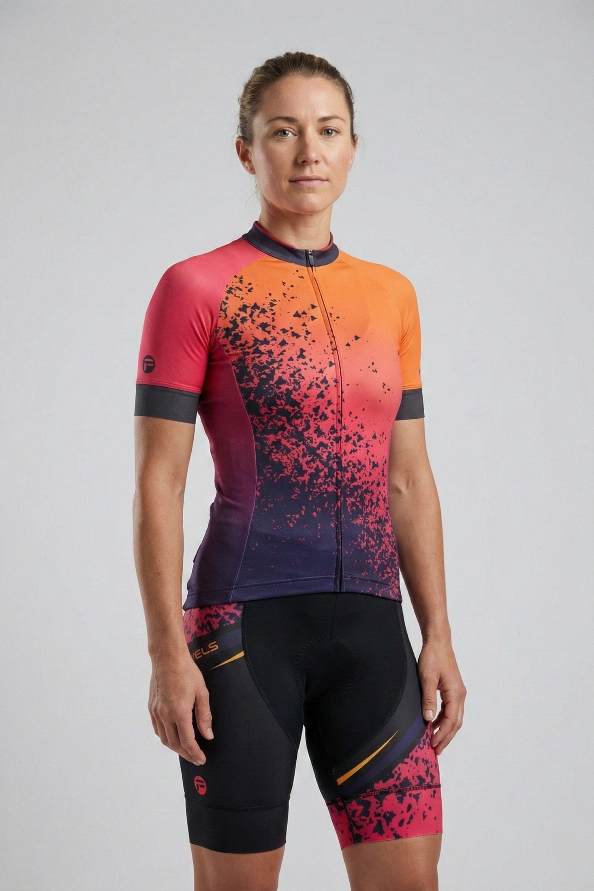 Person wearing a colorful cycling outfit with a gradient design on a plain background by Cycling Frelsi