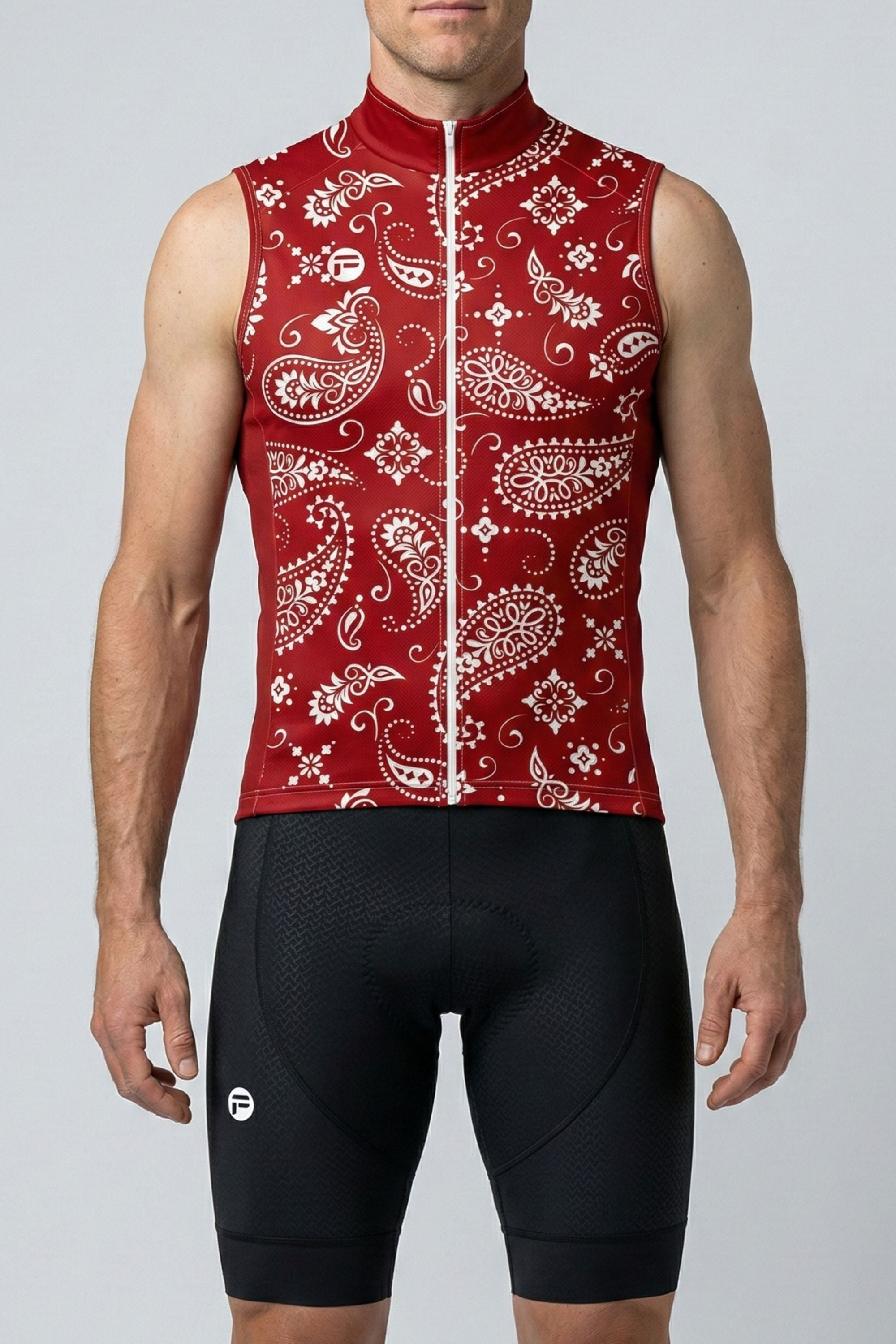 Person wearing a red sleeveless cycling jersey with white patterns on a gray background
