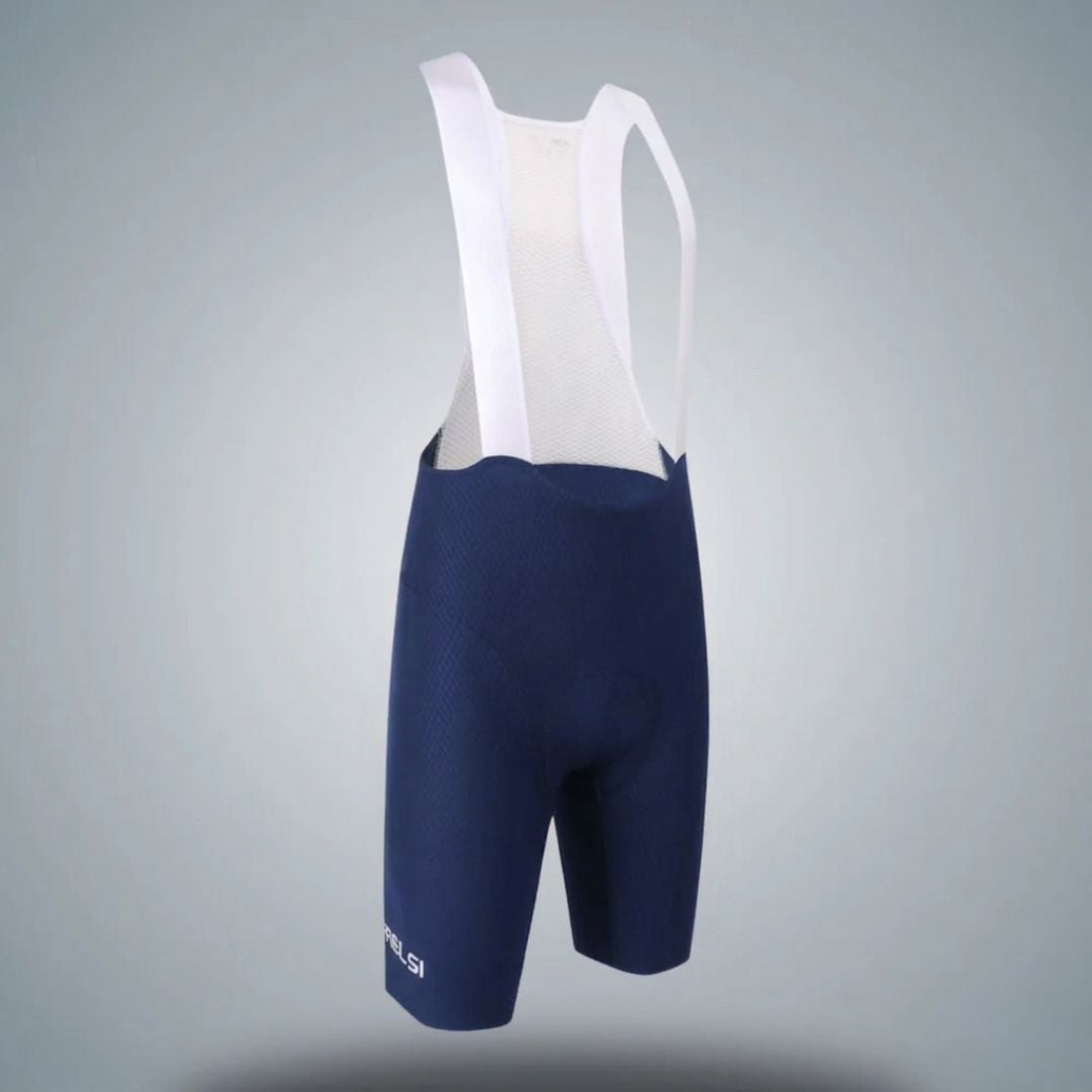 Navy cycling bib shorts with white straps on a gray background