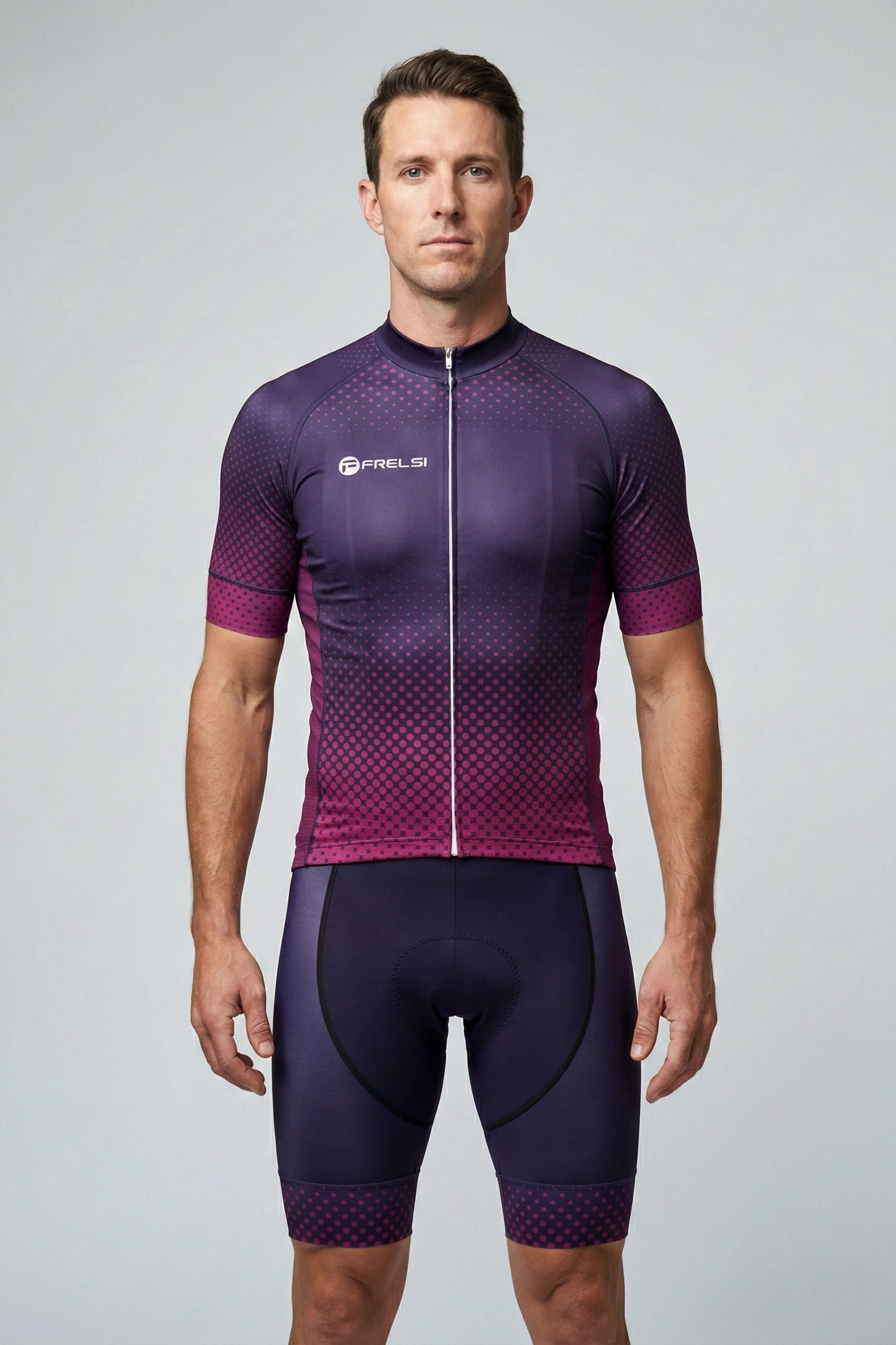 Man wearing a purple cycling outfit with a visible brand logo on a gray background