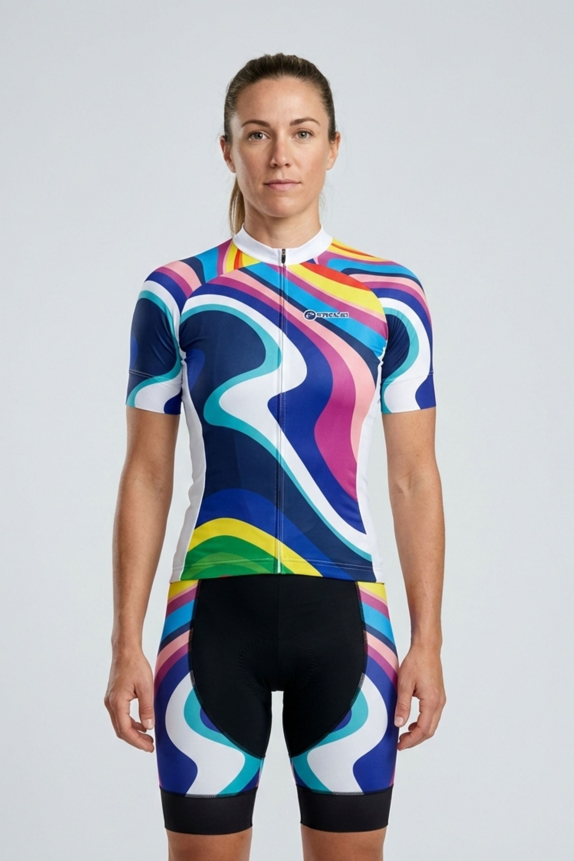 Person wearing a colorful cycling outfit on a plain background by Cycling Frelsi
