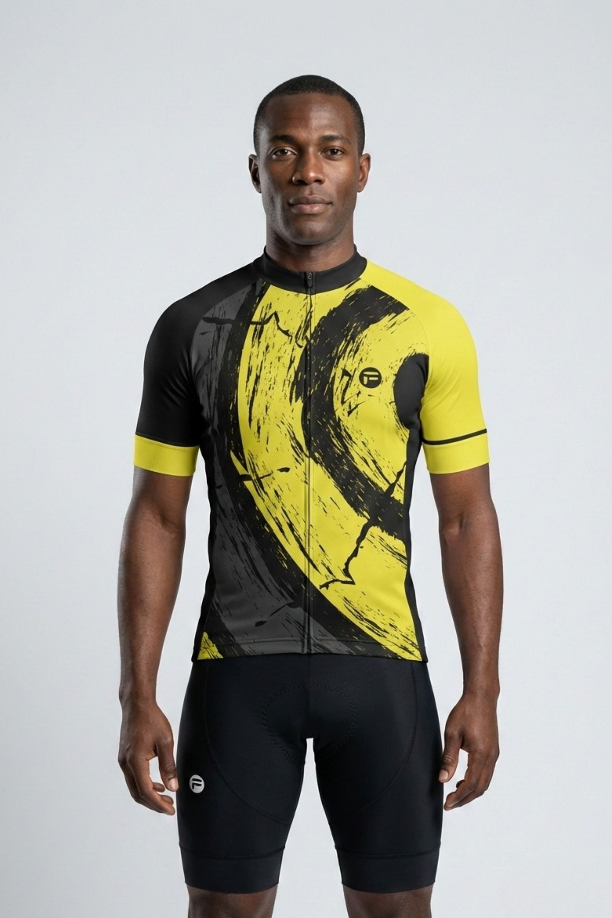 Person wearing a black and yellow cycling jersey on a white background