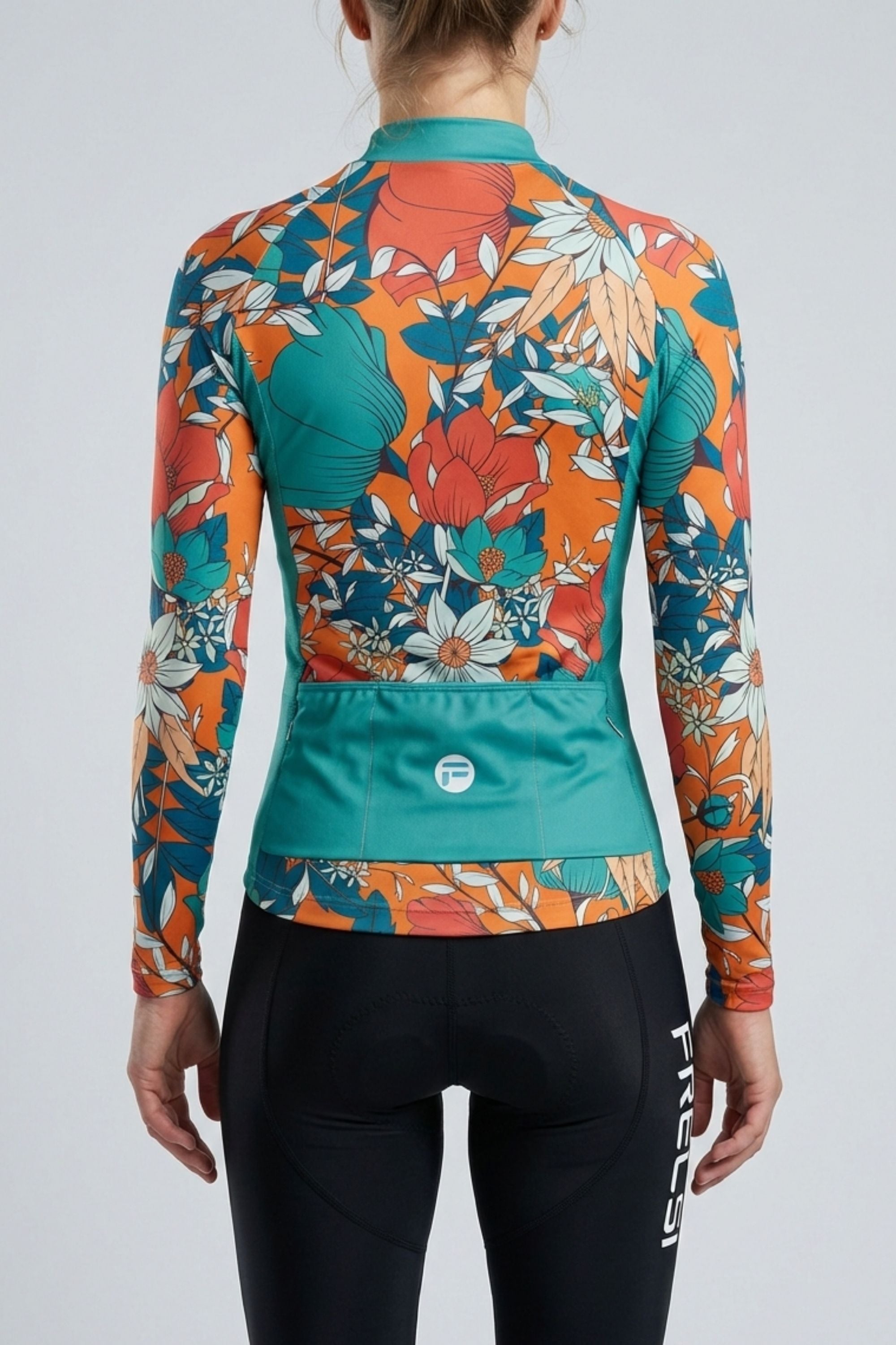 Person wearing a blue cycling outfit with orange flowers on a plain background by Cycling Frelsi