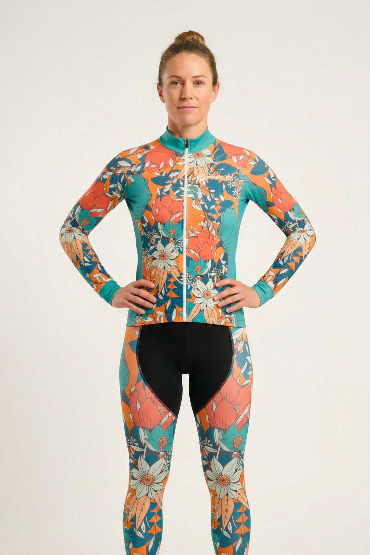 Person wearing a colorful floral cycling suit on a white background