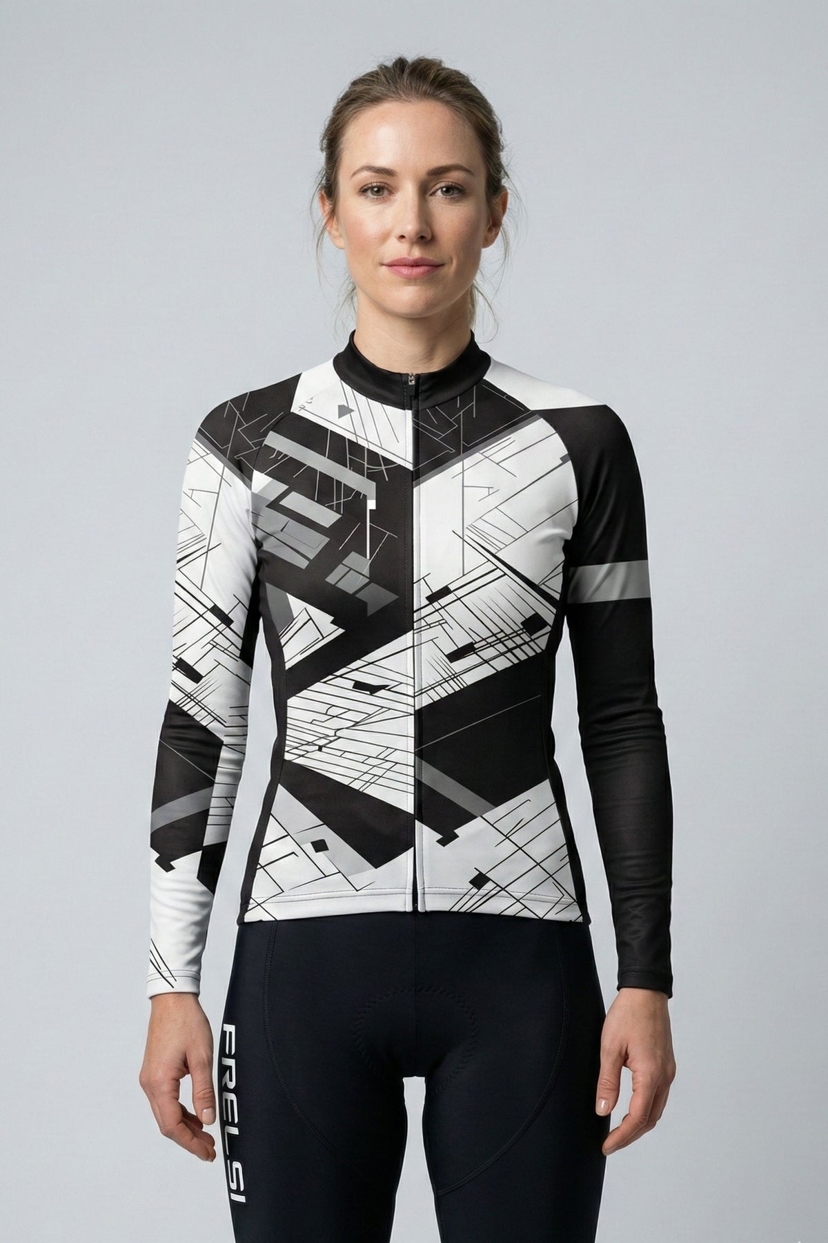Person wearing a white cycling outfit with black stripes on a plain background by Cycling Frelsi