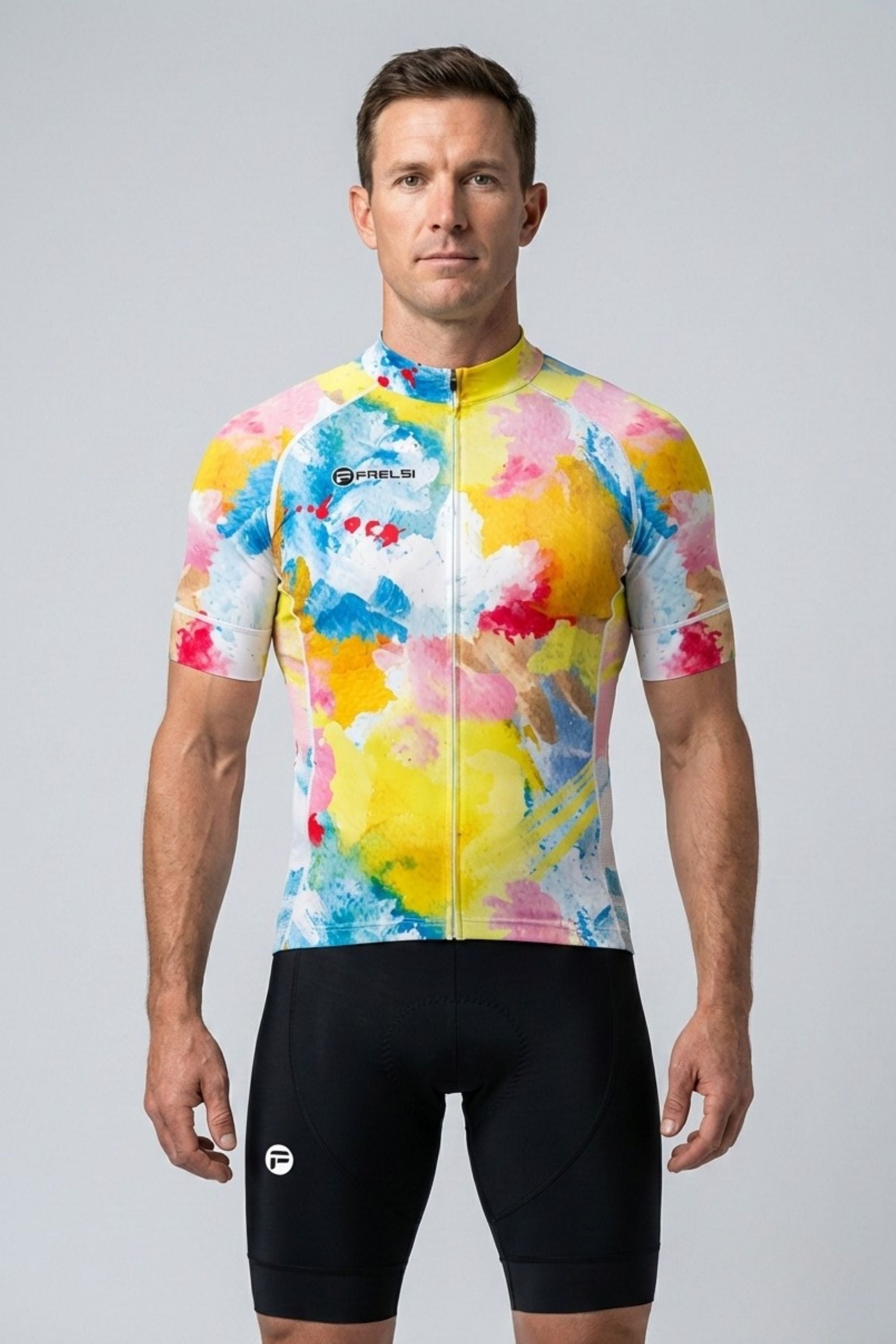 Man wearing a colorful cycling jersey and black shorts on a gray background