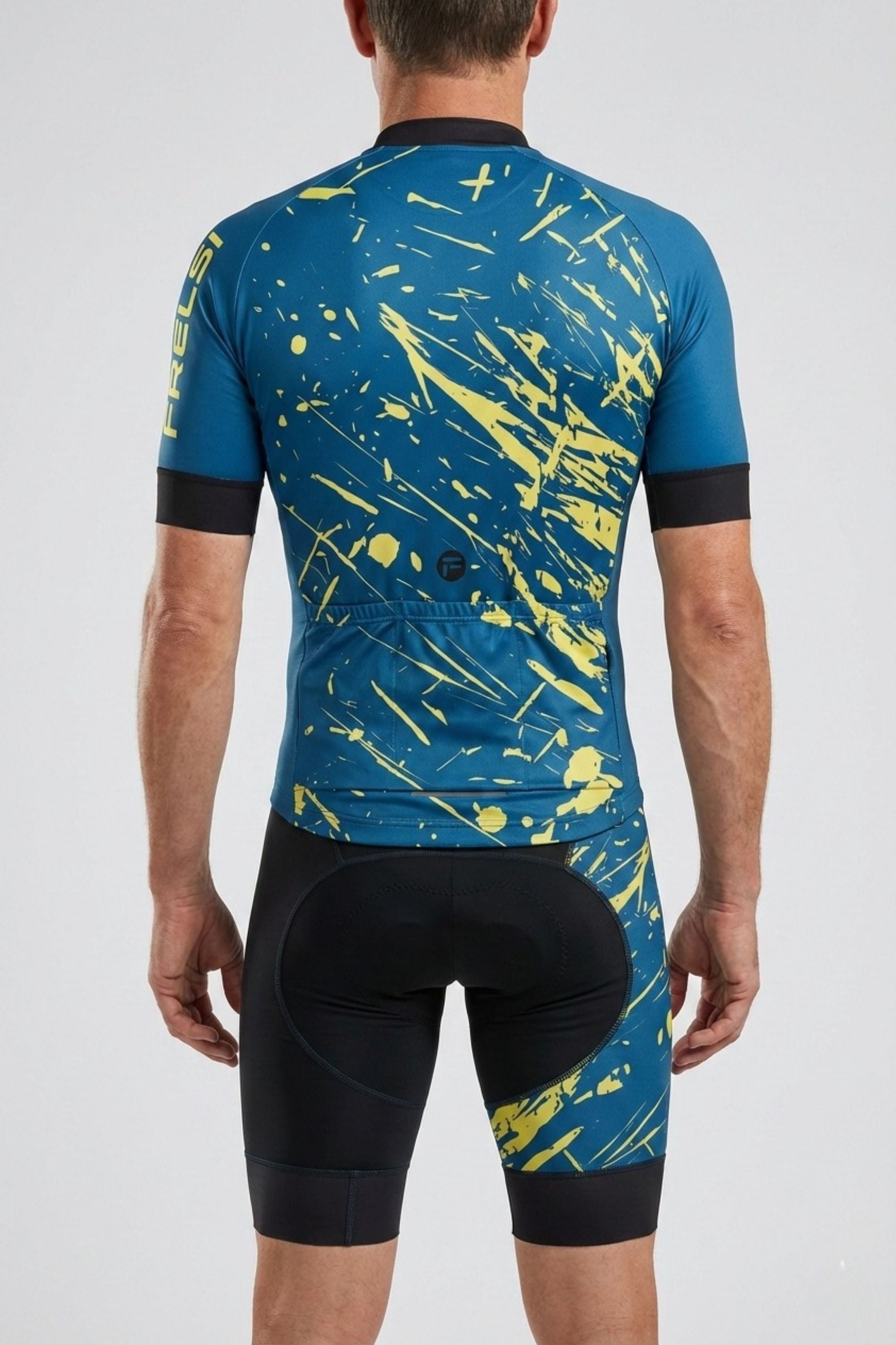 Cycling outfit with blue and yellow splatter pattern on a plain background
