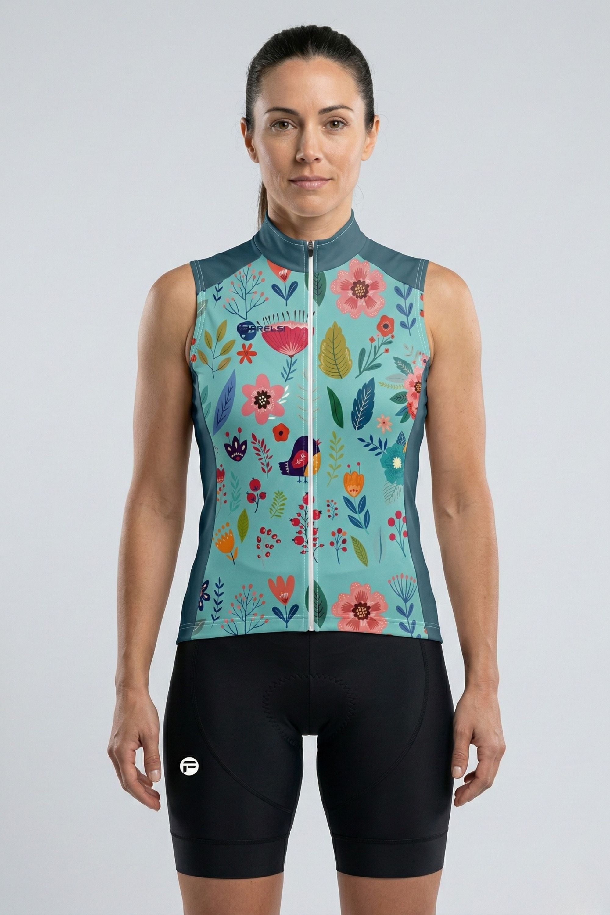 Woman wearing a floral patterned sleeveless cycling outfit on a light gray background