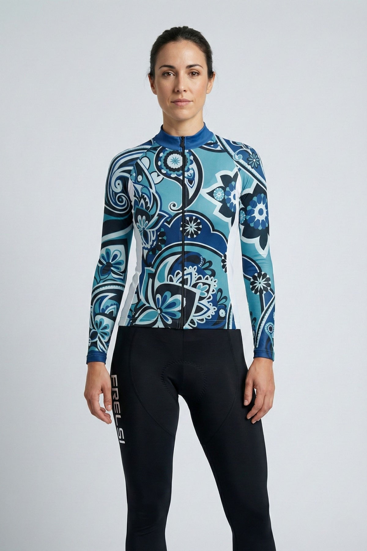 Person wearing a blue cycling outfit on a plain background by Cycling Frelsi 