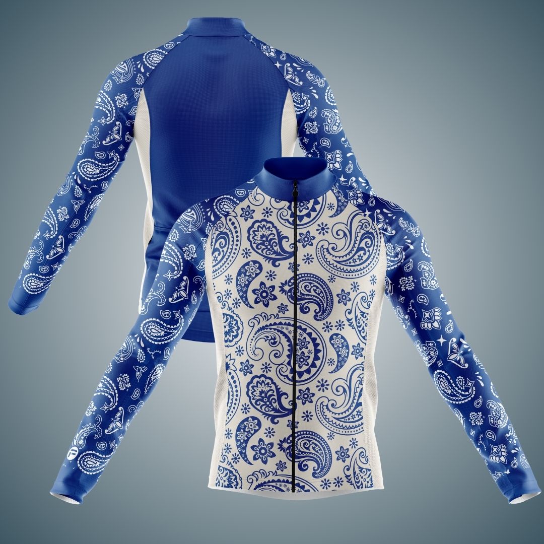 Blue and white long sleeve cycling jersey featuring an intricate paisley and floral pattern. The jersey includes a full zipper front and is designed for cooler weather, offering both style and comfort.