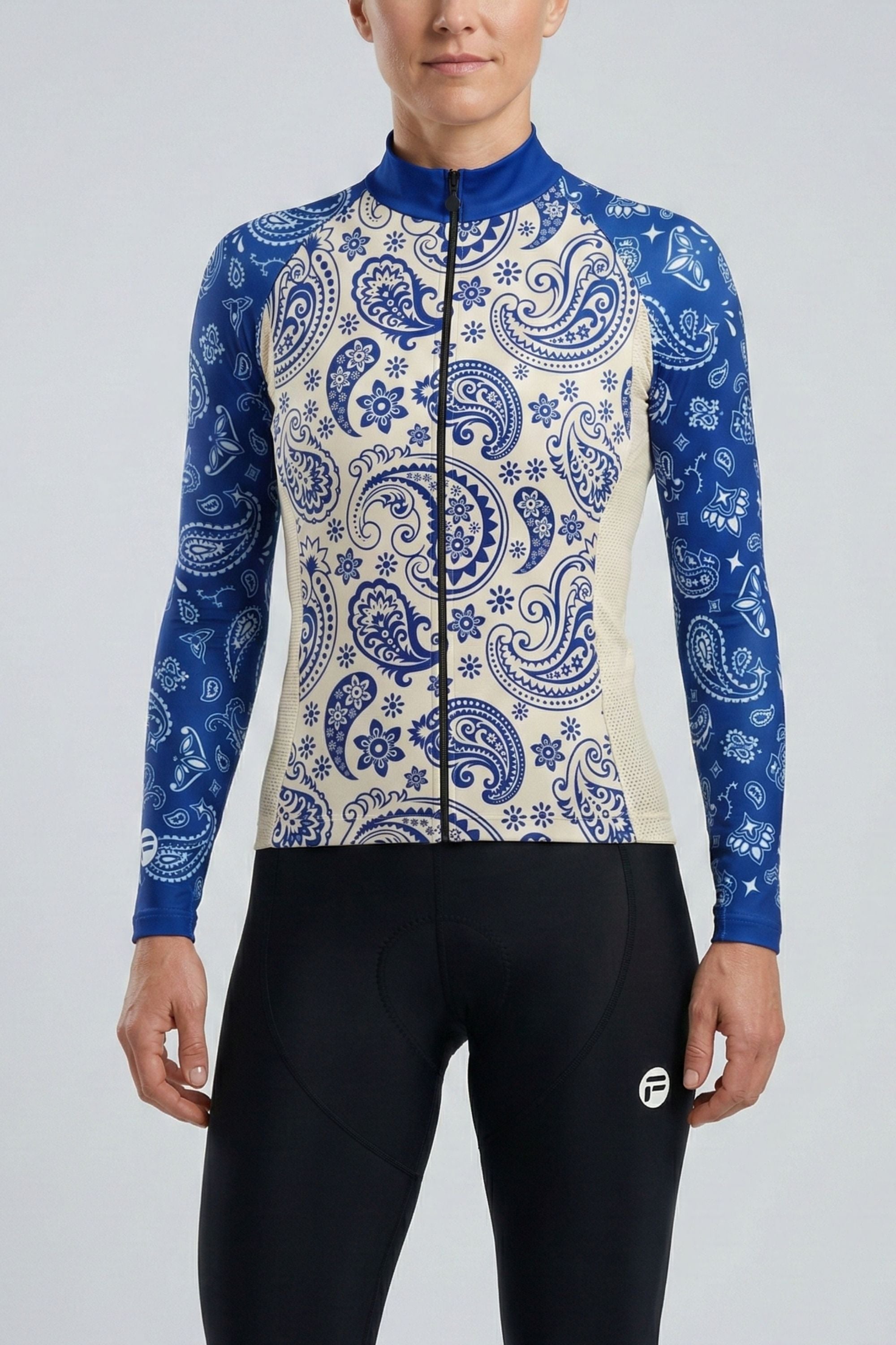 Person wearing a blue and white patterned cycling jersey on a gray background