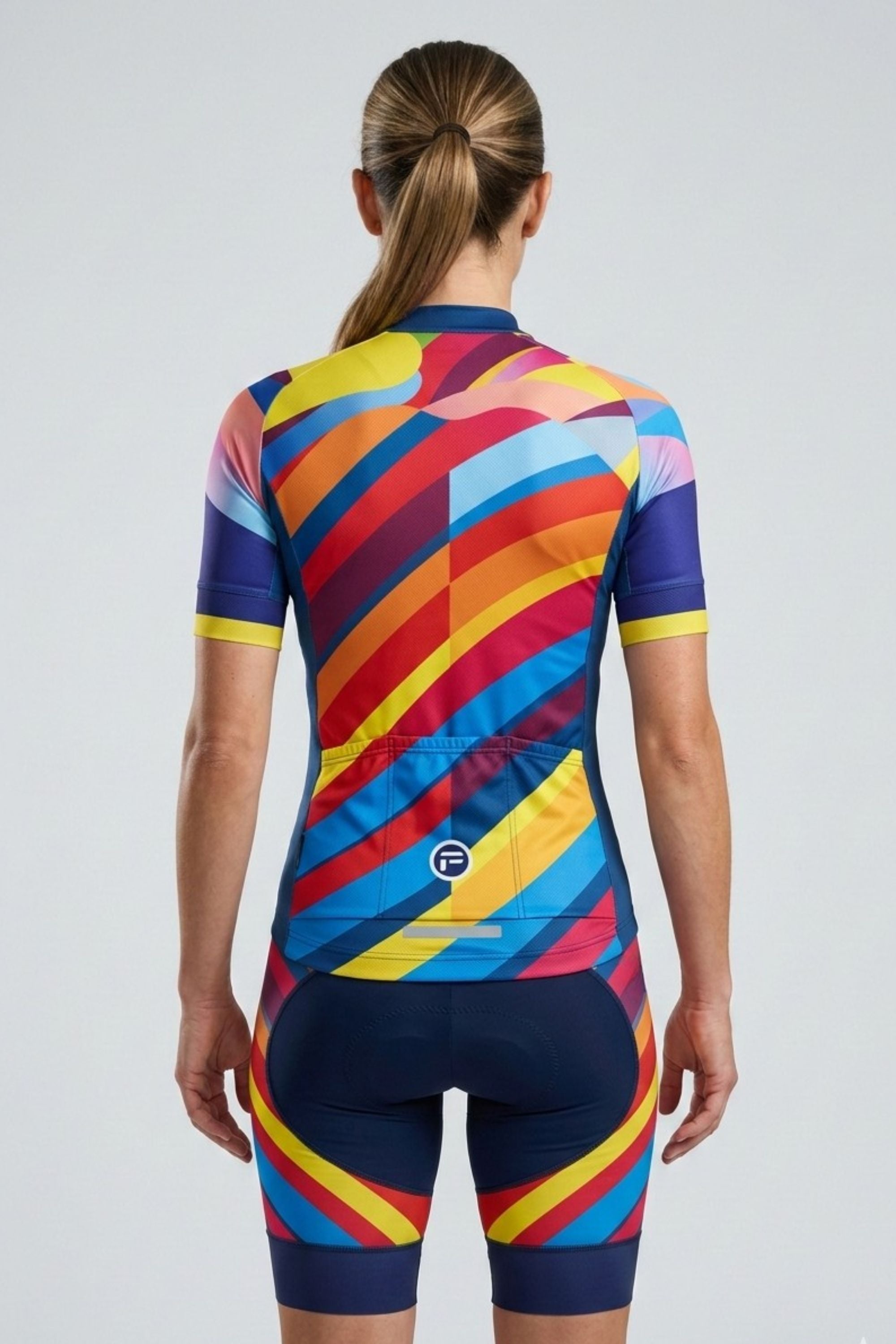 Colorful cycling suit with geometric pattern on a plain background