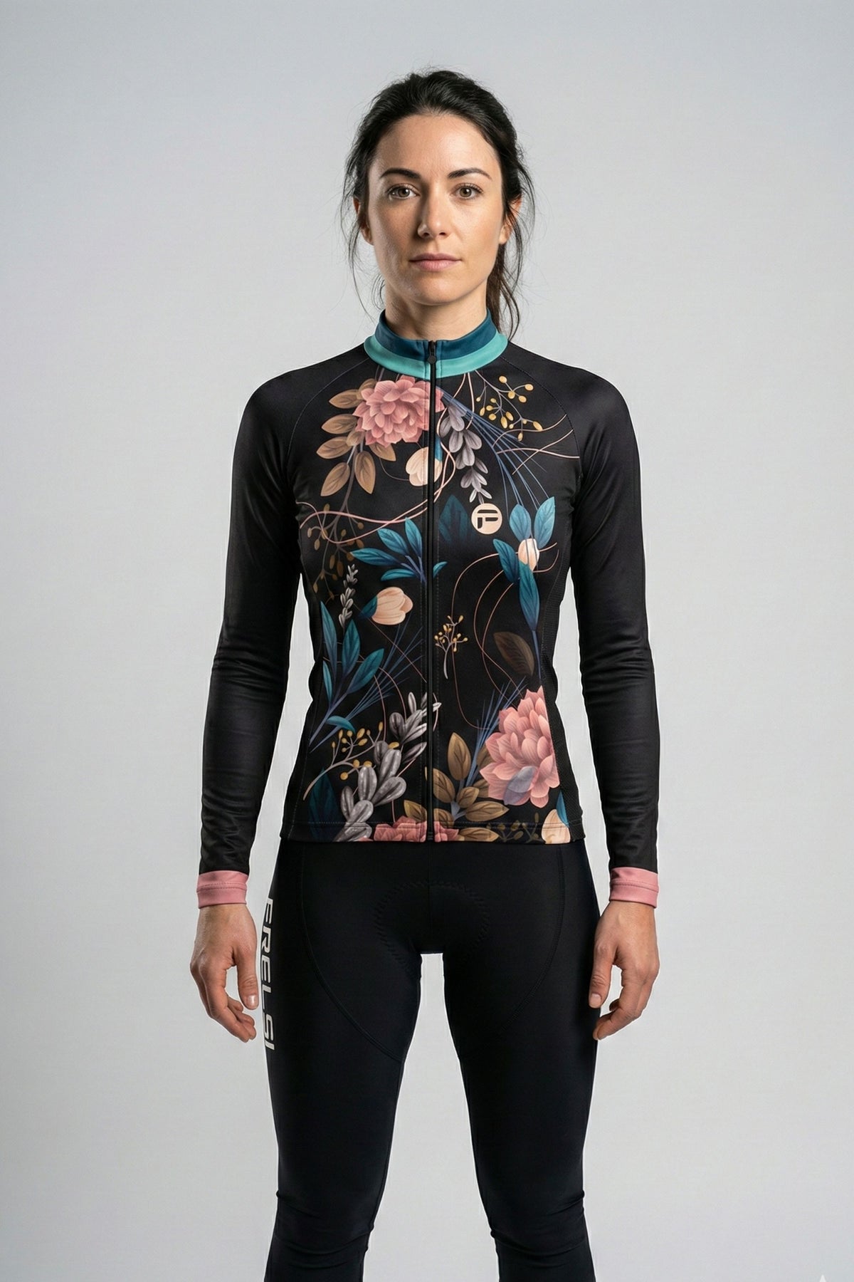 Person wearing a black cycling jersey with Exotic_Spring flowers accents by Cycling Frelsi on a gray background