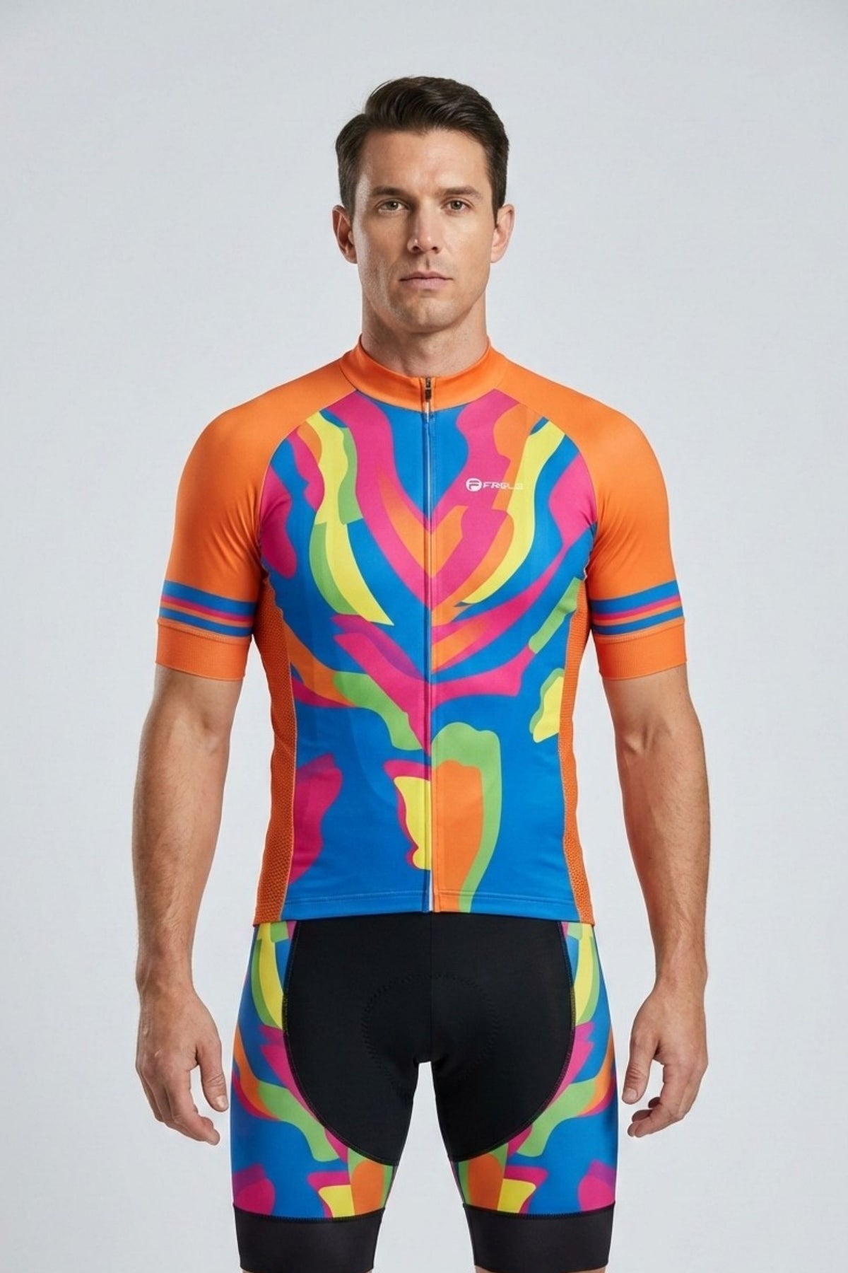 Man wearing a colorful cycling jersey and shorts on a light gray background