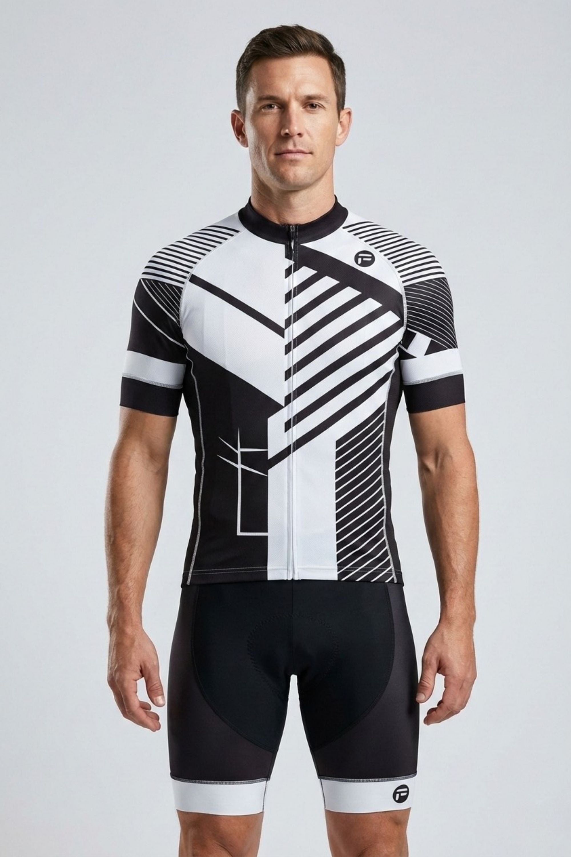 Man wearing a black and white cycling outfit on a light gray background