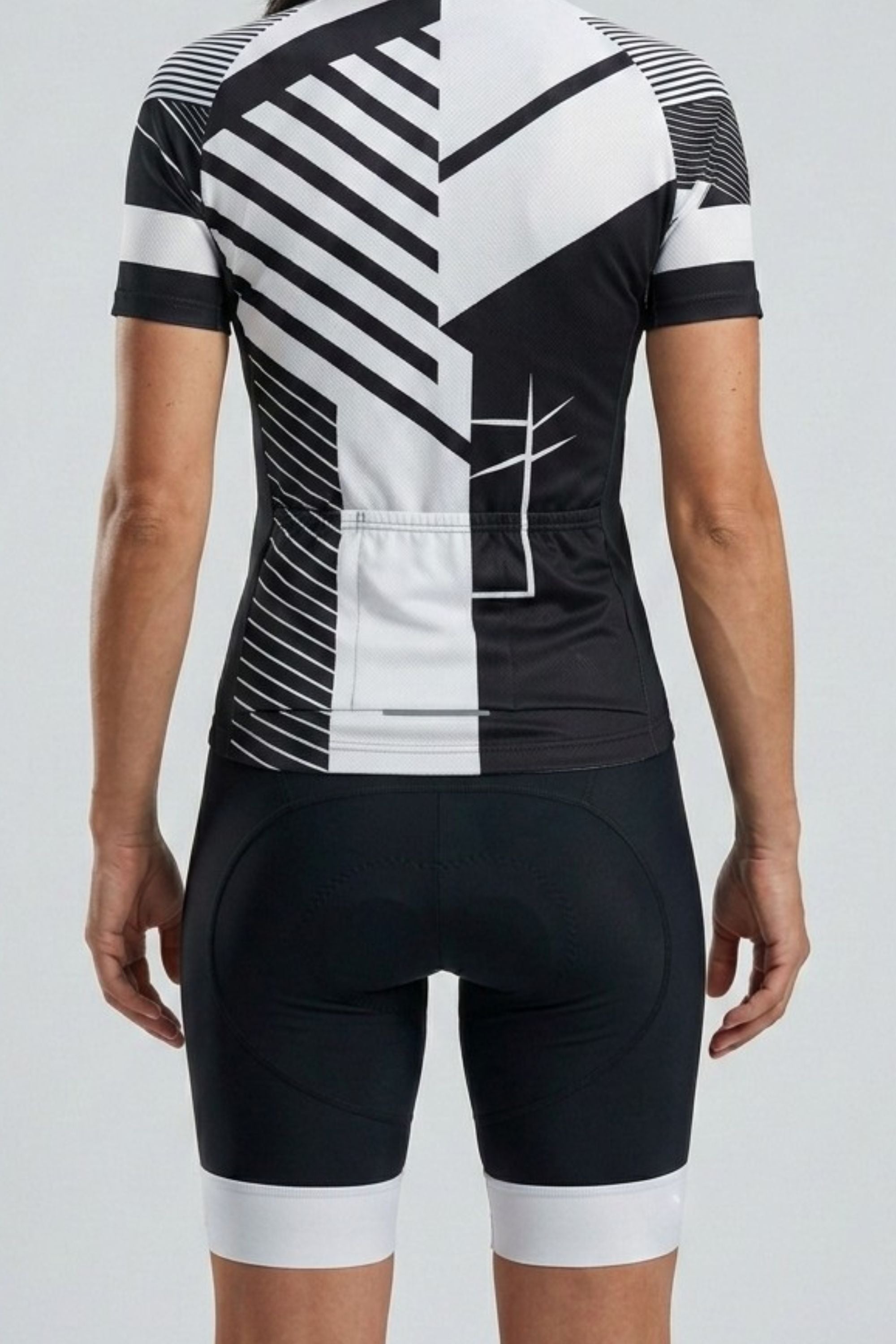 Cycling outfit with black and white geometric pattern on a plain background
