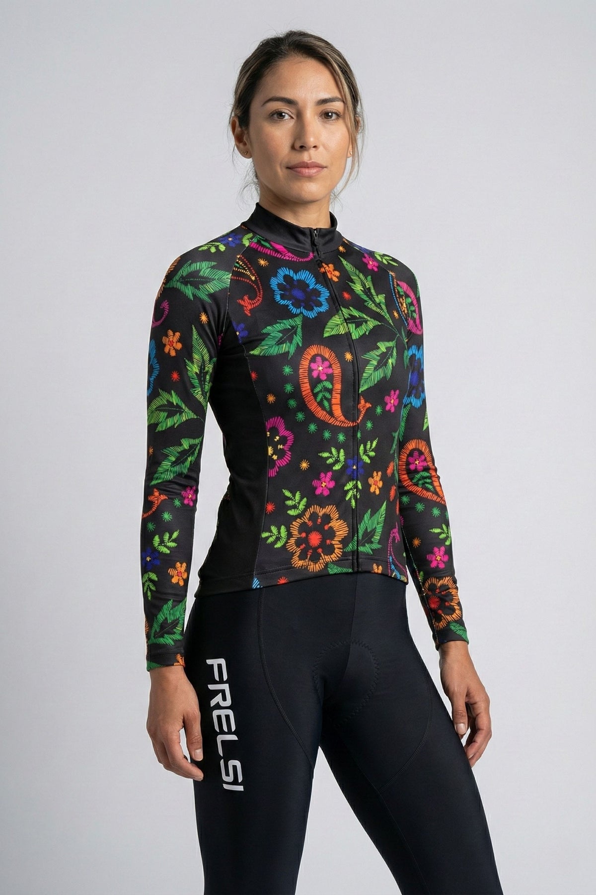 Person wearing a black cycling outfit on a plain background by Cycling Frelsi 