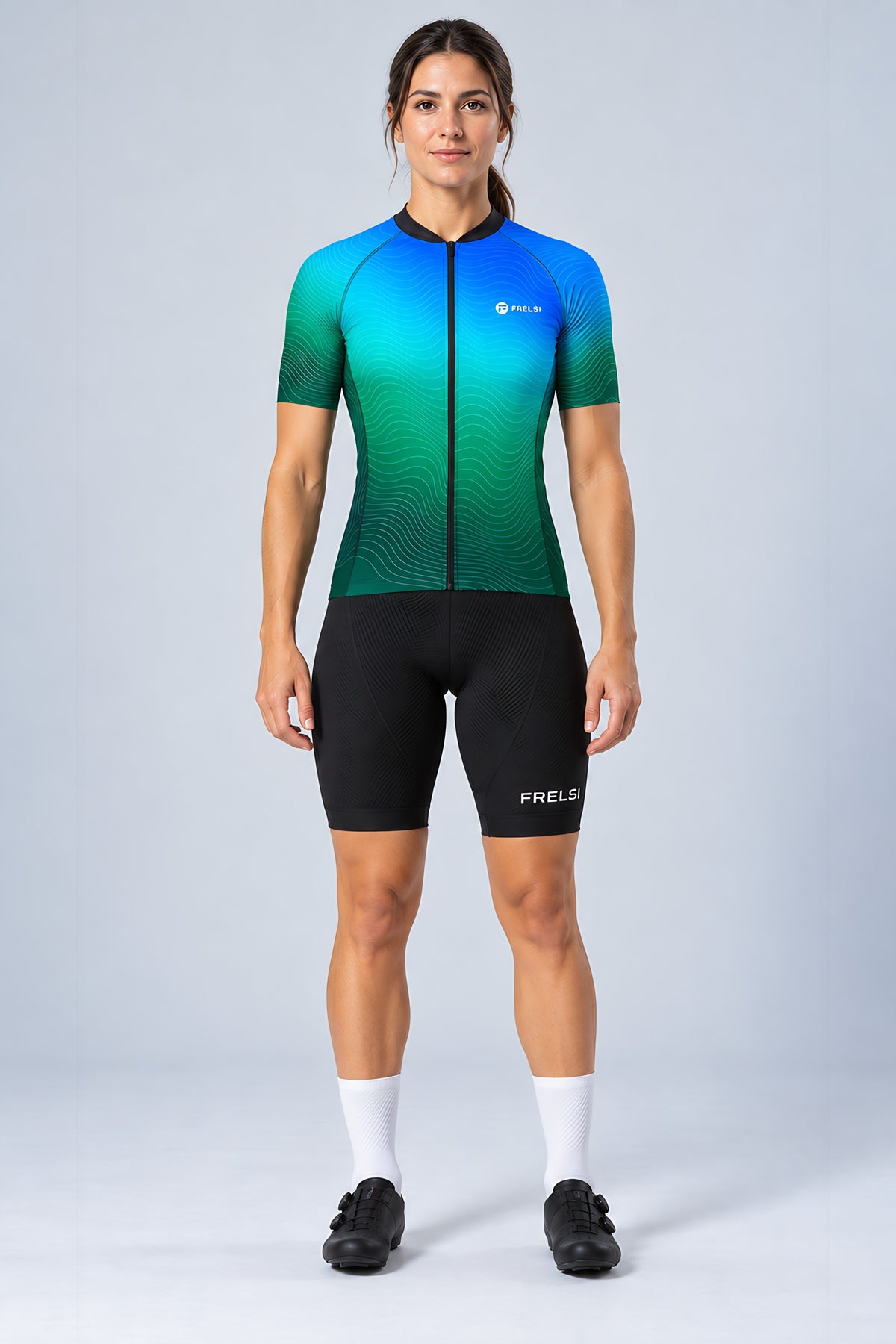 Woman wearing the Ocean Pulse short sleeve cycling jersey with black bib shorts - front view