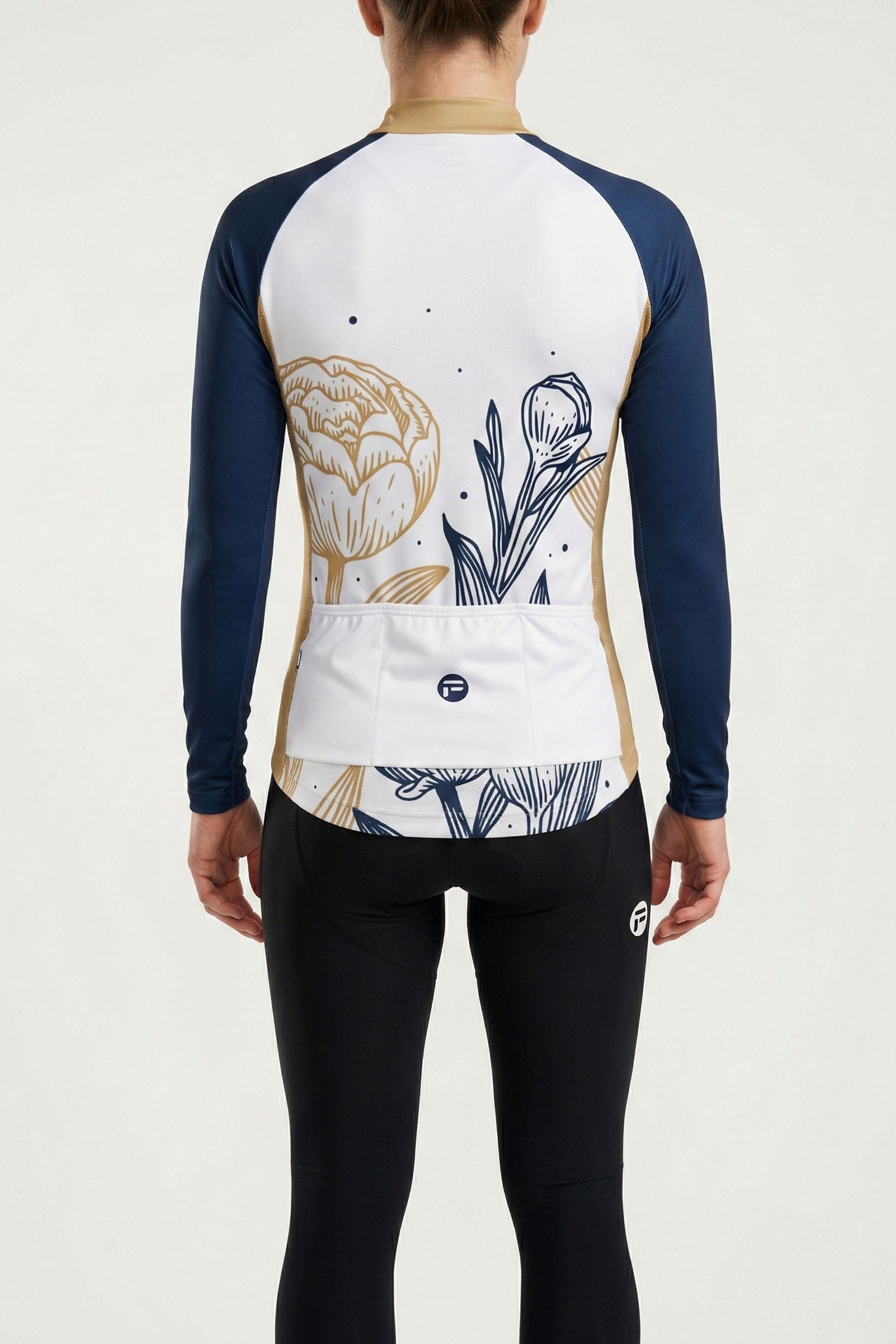 Person wearing a long-sleeve cycling jersey with floral design on a white background