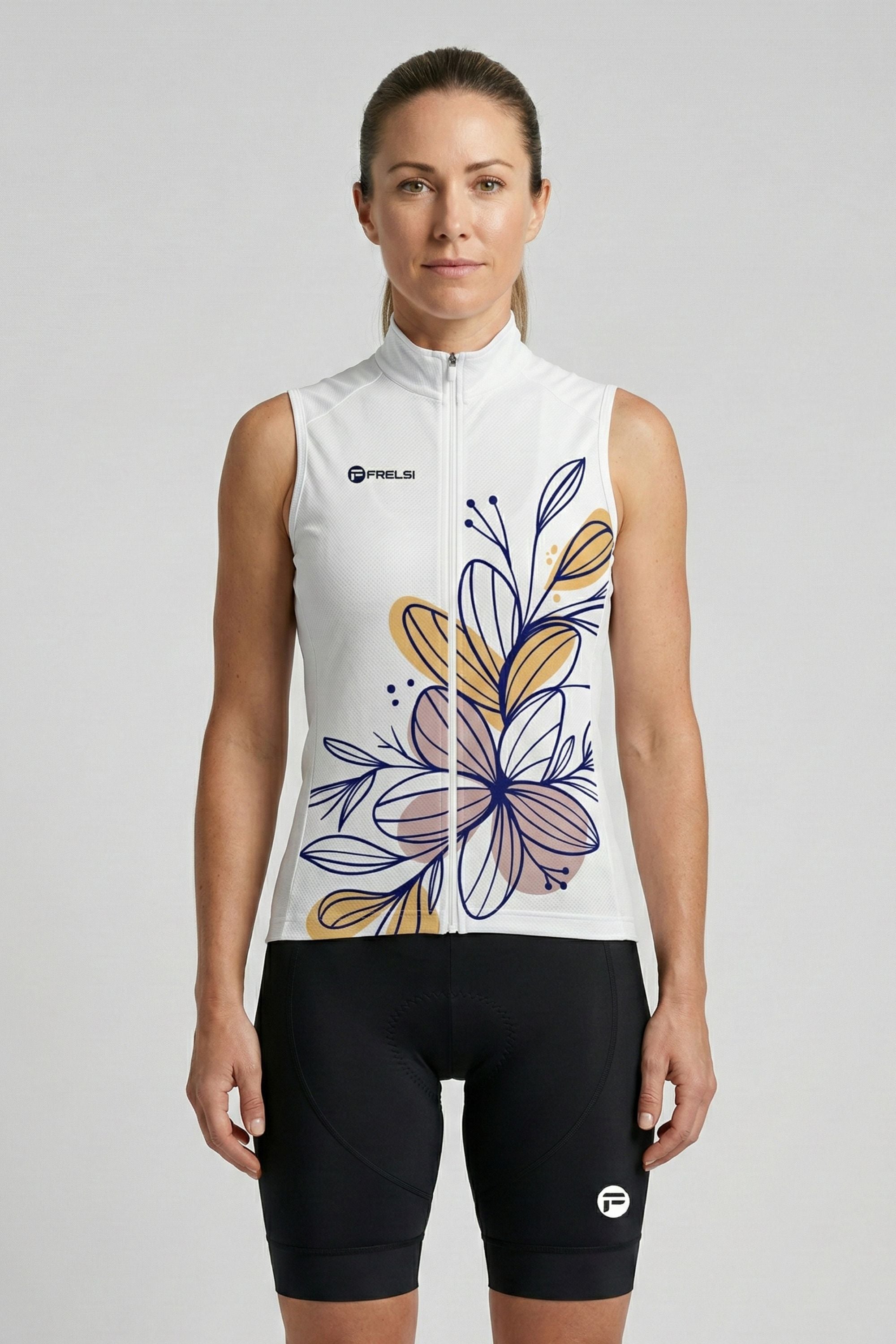 Woman wearing a sleeveless cycling outfit with floral design on a plain background