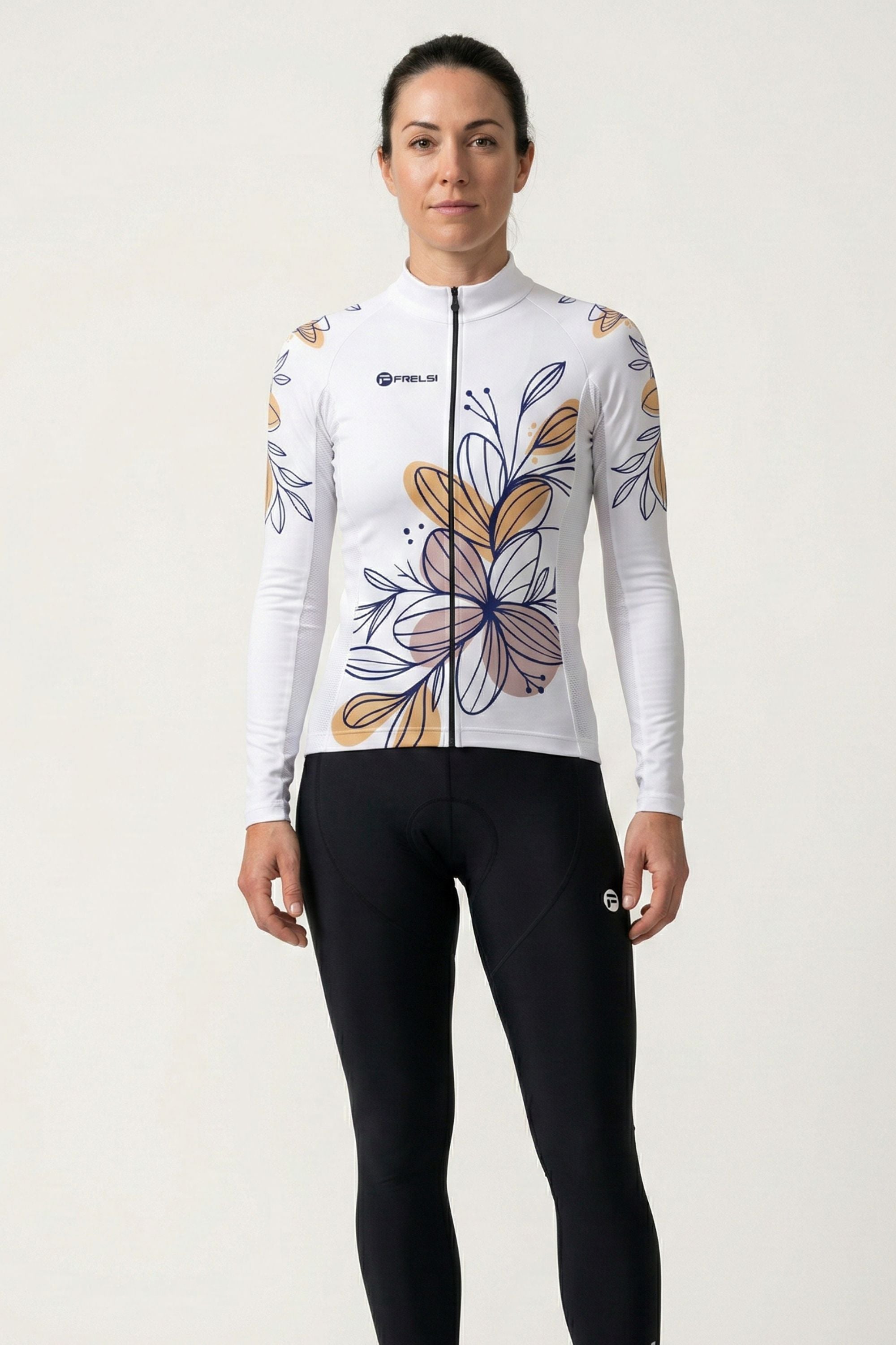 Person wearing a white cycling jersey with floral designs on a plain background