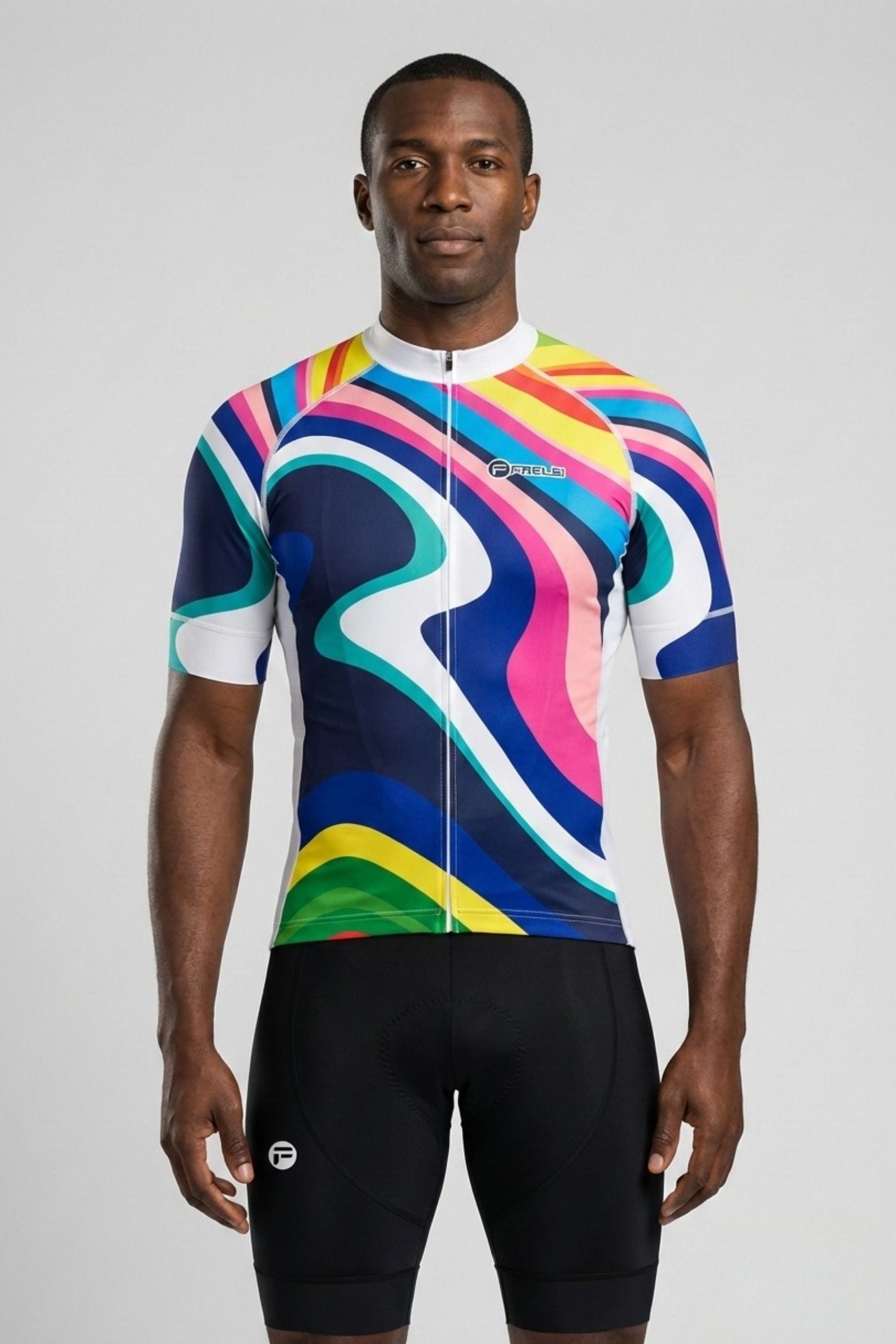 Person wearing a colorful cycling jersey and black shorts on a gray background