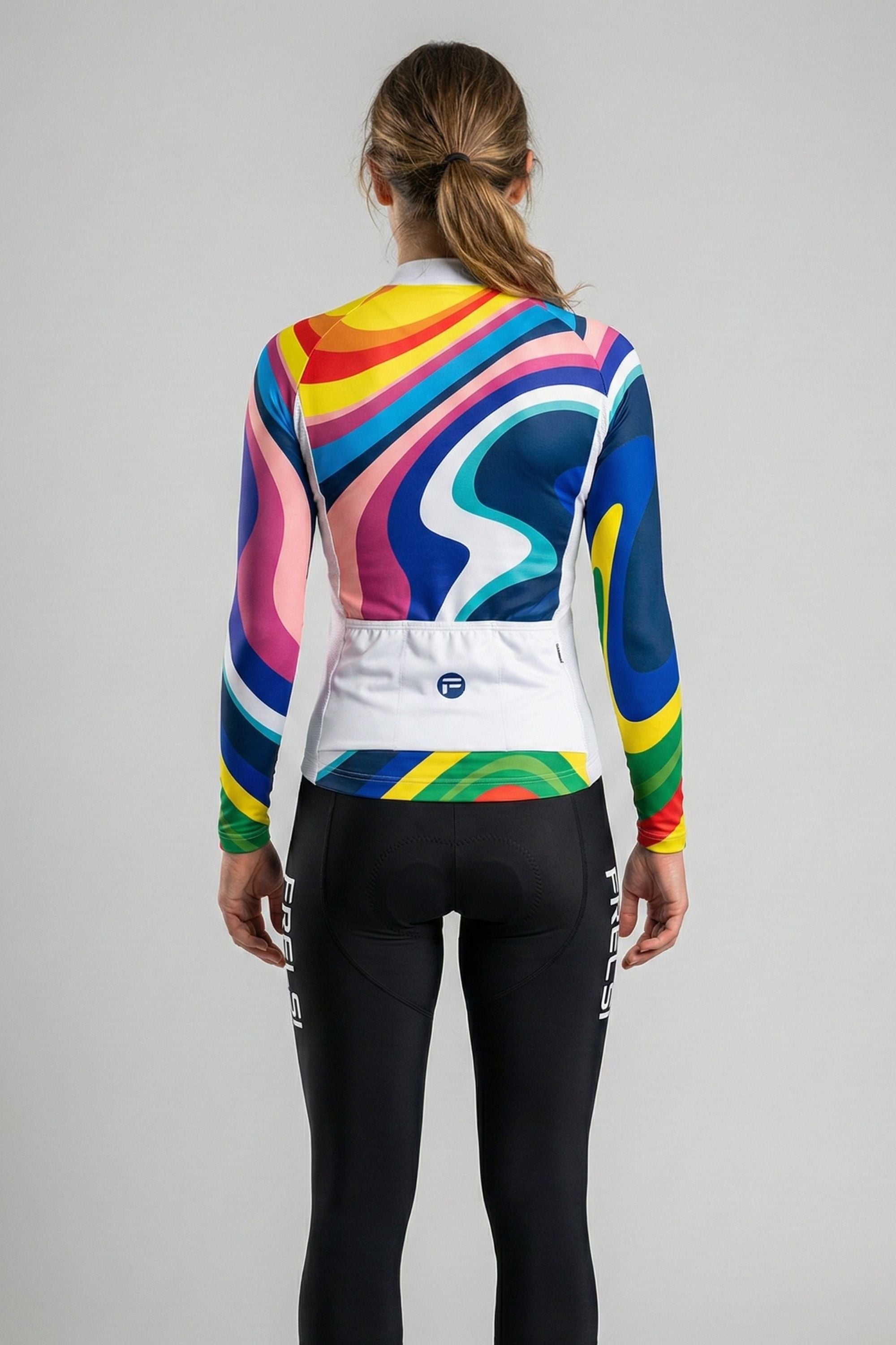 Person wearing rainbow colors cycling jersey accents by Cycling Frelsi on a gray background