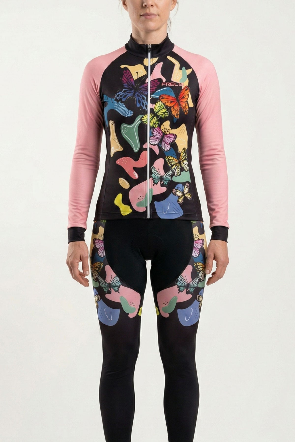 Person wearing a colorful butterfly-themed cycling outfit with pink sleeves on a white background