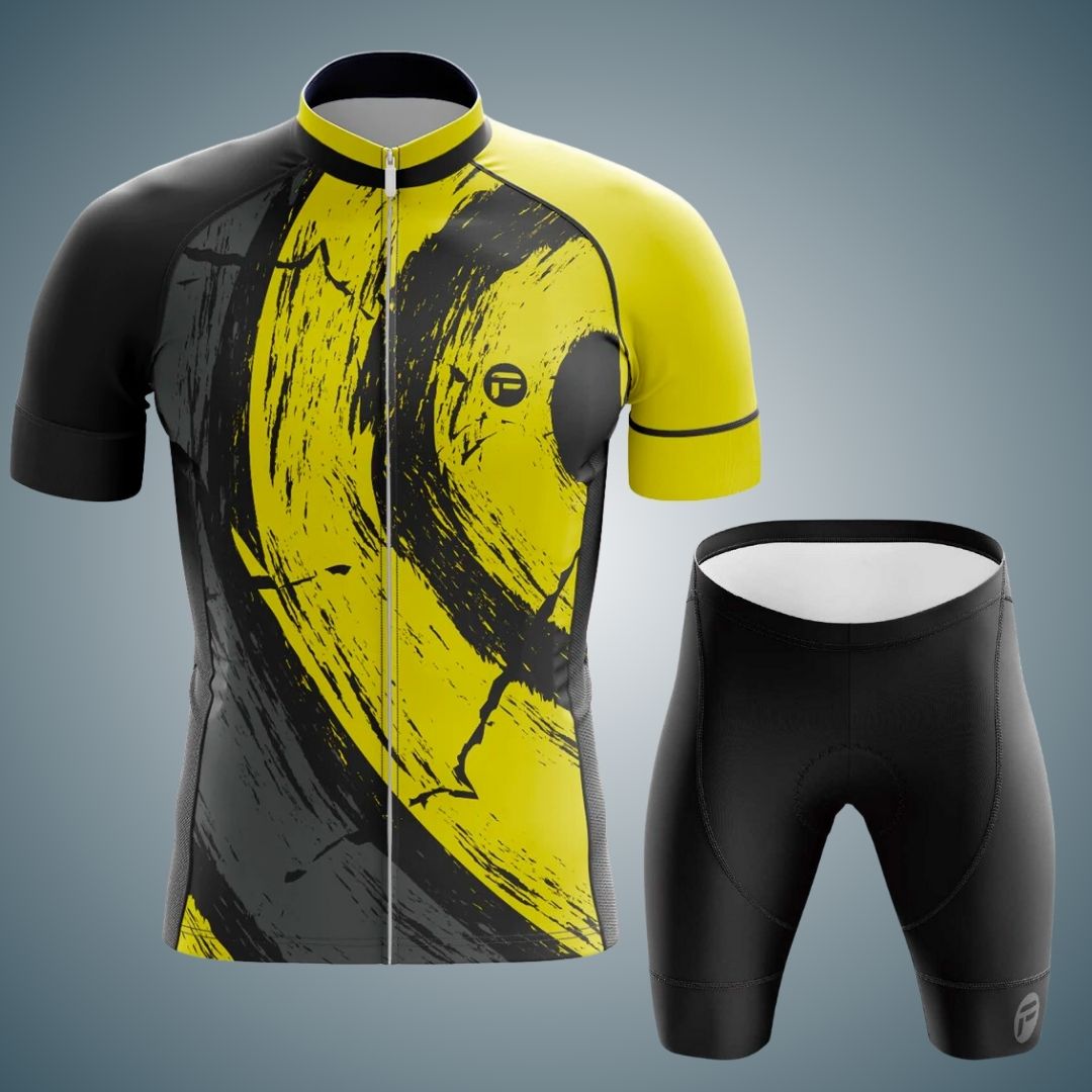 Men's short sleeve cycling jersey and shorts set in black and yellow with bold abstract brushstroke design. The jersey features a full zipper front and the shorts provide a matching sleek, aerodynamic fit.