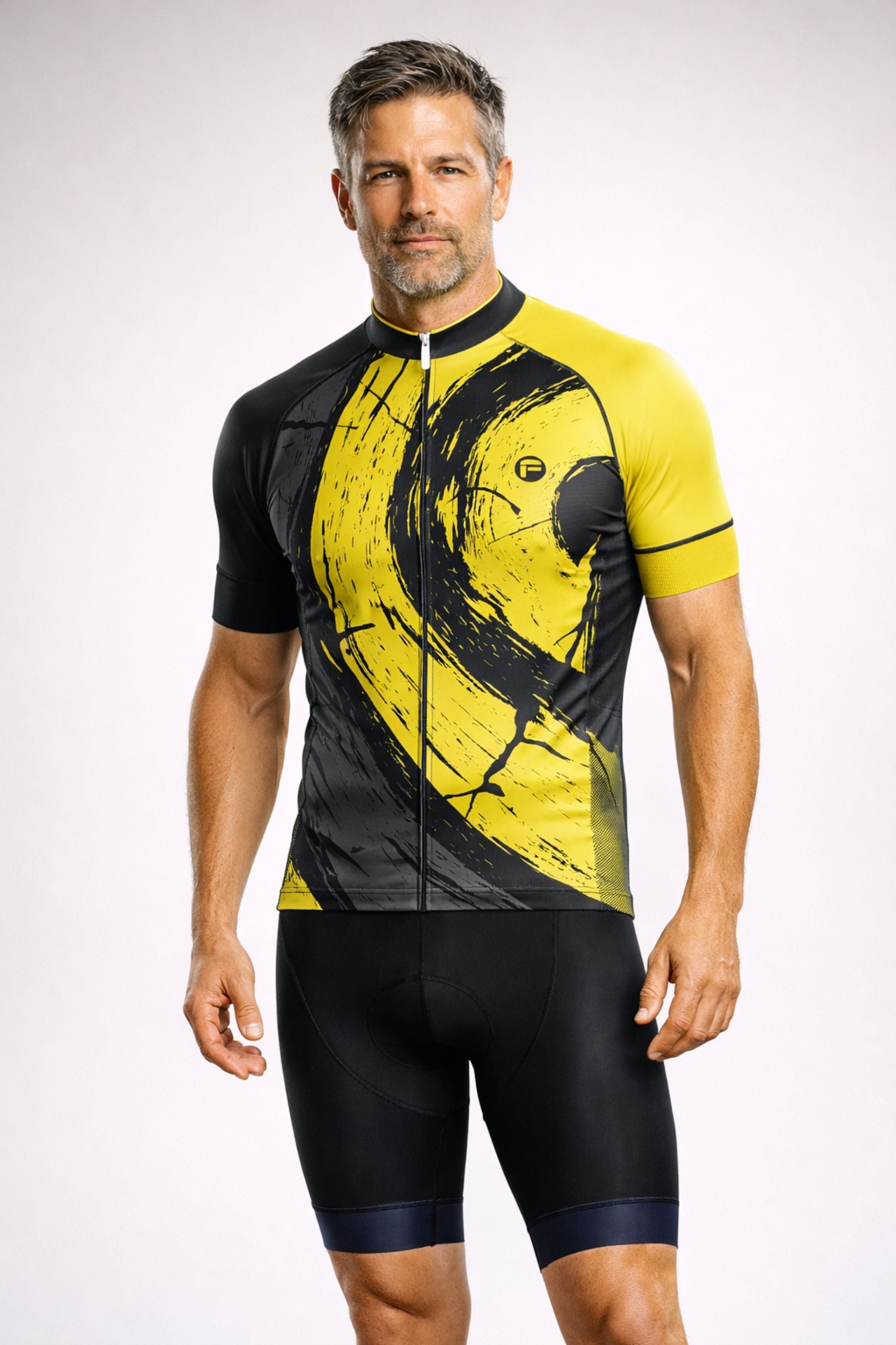 Man wearing a yellow and black cycling jersey with shorts on a white background - Sky Circles | Men's Short Sleeve Cycling Set