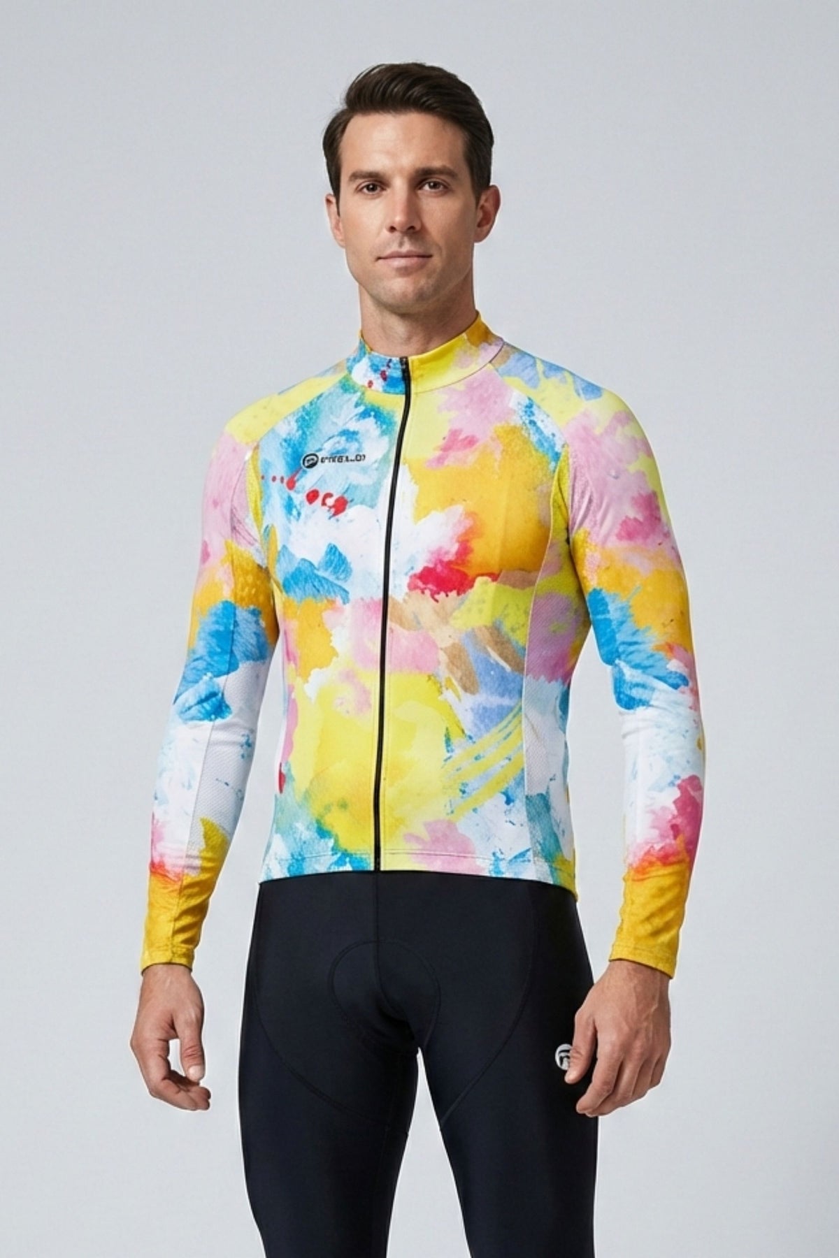 Man wearing a colorful cycling jersey and black shorts on a gray background