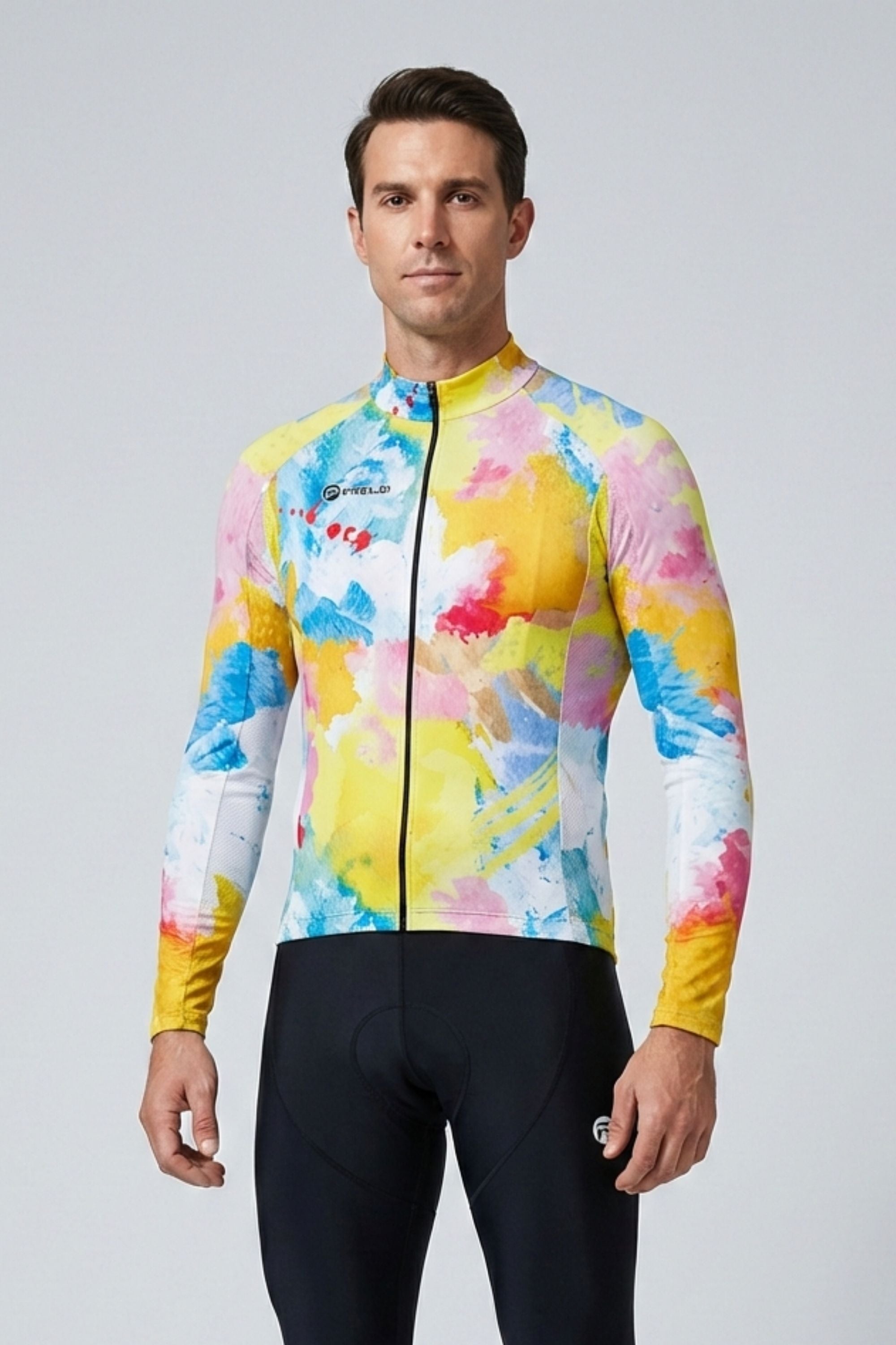 Man wearing a colorful cycling jersey and black shorts on a gray background