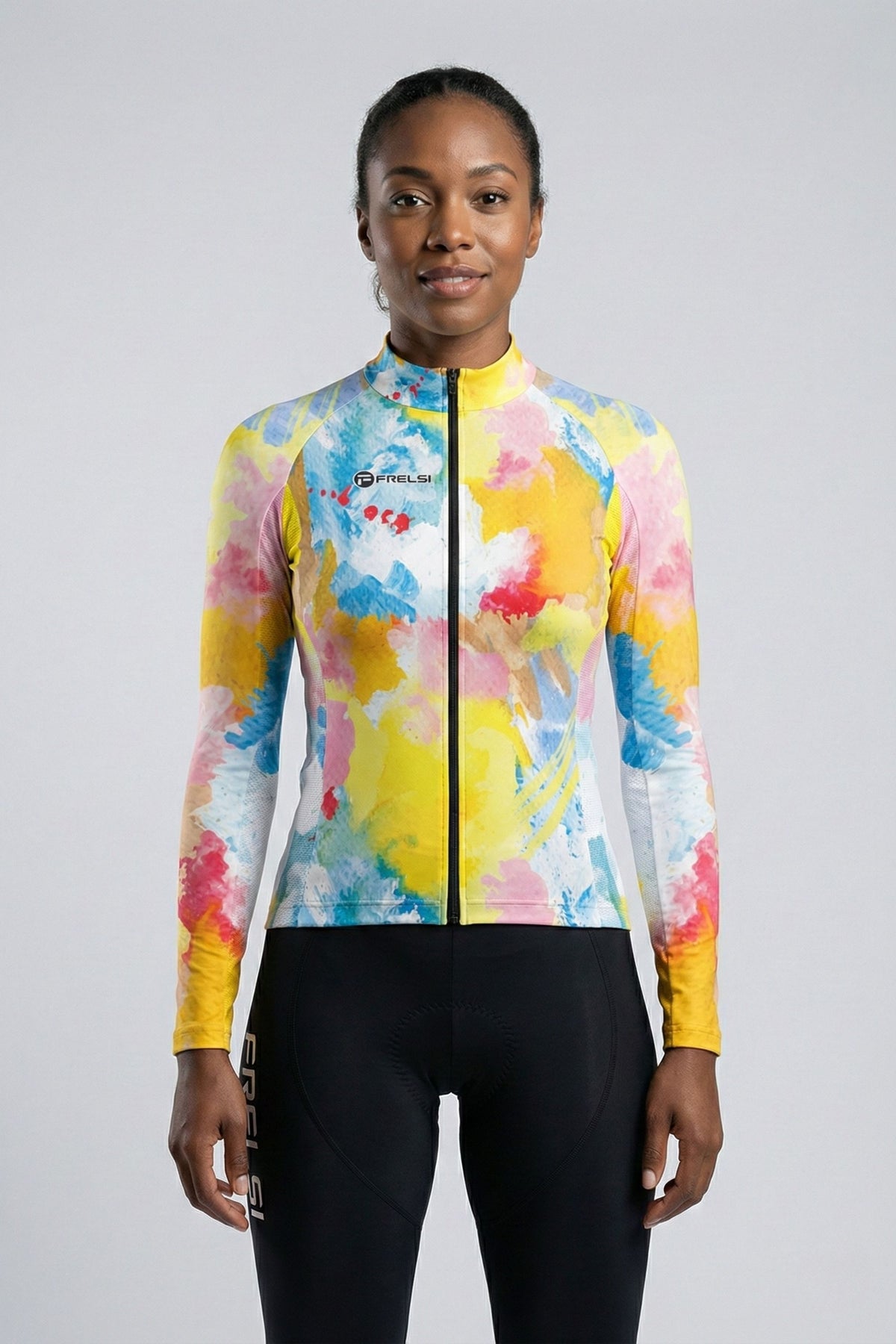 Person wearing a colorful cycling jersey accents by Cycling Frelsi on a gray background