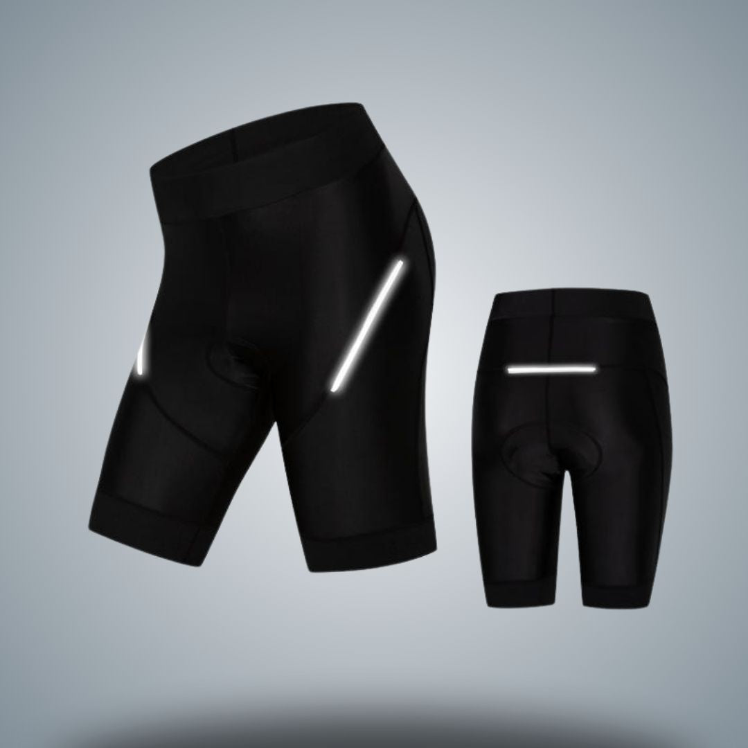 Women's black cycling shorts featuring reflective accents for enhanced visibility in low-light conditions. Designed with a comfortable fit, supportive waistband, and ergonomic padding for long rides. Ideal for both casual and performance cycling